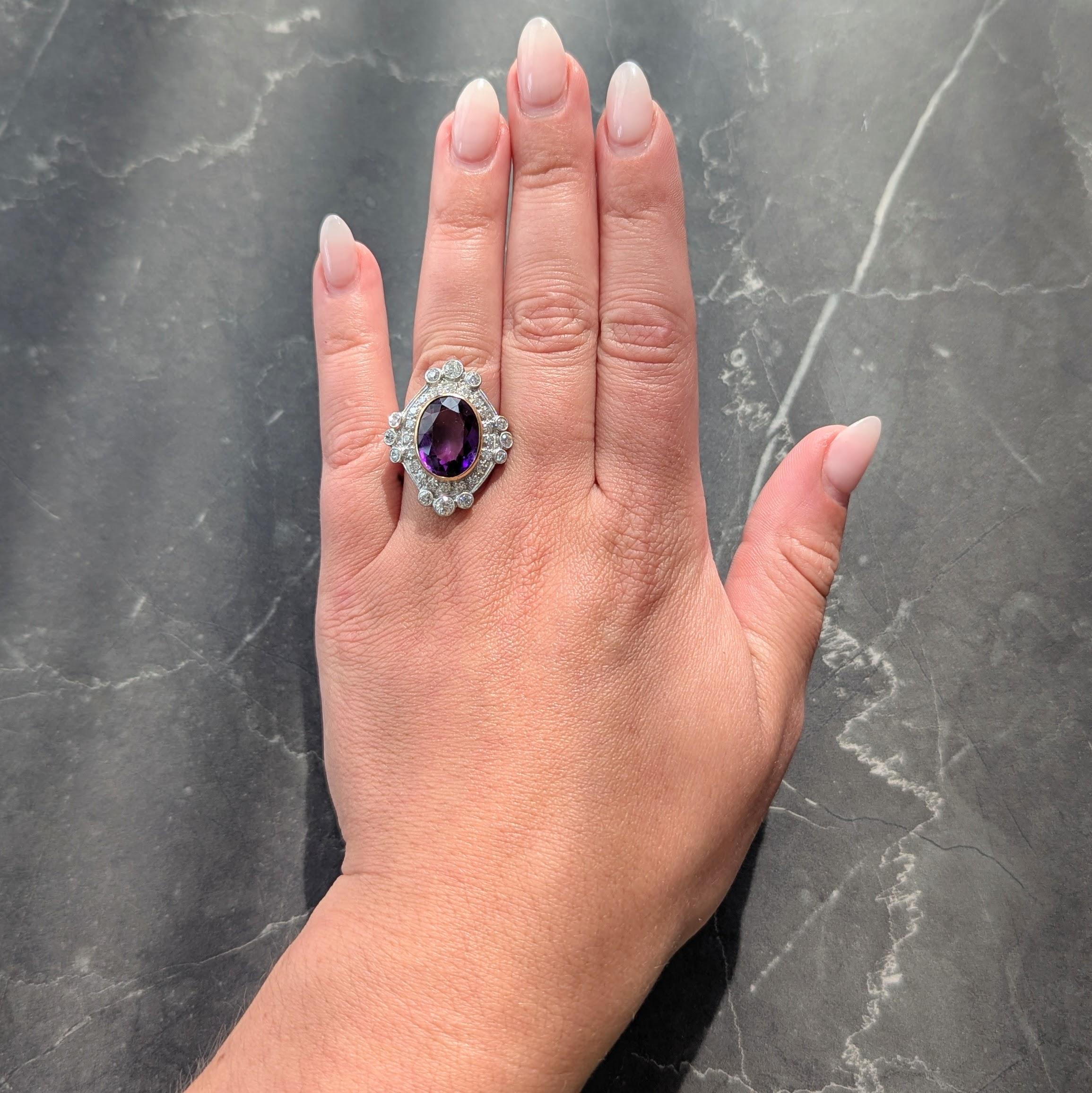 Centering an oval cut amethyst weighing approximately 6.45 carats - transparent medium purple
Bezel set in yellow gold with a recessed navette shaped platinum-topped surround
Bead set with a halo surround of single cut diamonds with compass style