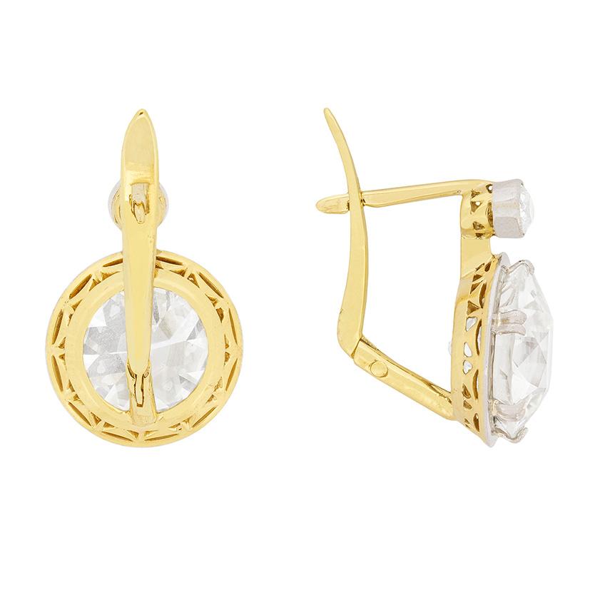 These breath-taking earrings are hand made and feature hand cut diamonds. The main stones are old cut diamonds, one weighs 4.11 carat and the other weighs 4.20 carat. Both have individual certificates from renowned HRD and have been graded as J in
