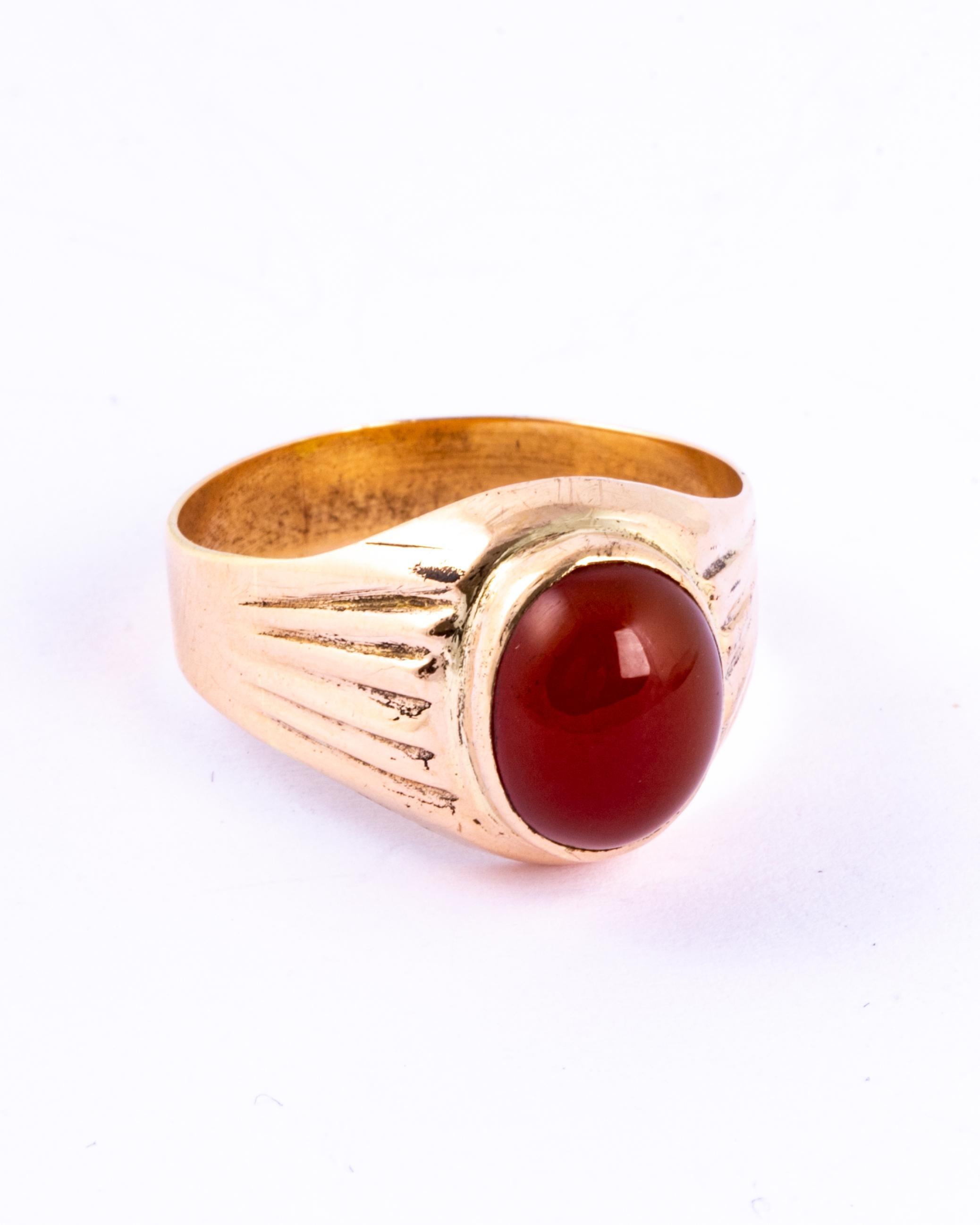 A fine vintage signet ring set with a cabochon carnelian stone. Modelled in 9 carat yellow gold. 

Ring Size: W or 11
Stone Dimensions: 11x9mm
Ring Width: 14mm

Weight: 4.5g