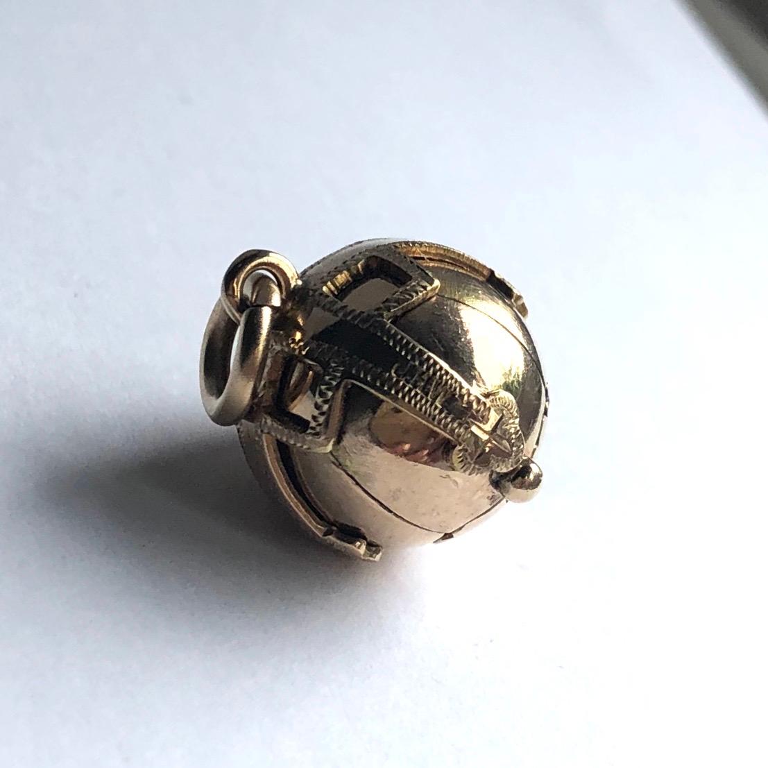 This classic masonic orb is modelled in 9 carat gold with silver underneath to show the engraving. 

Orb Diameter Closed: 15mm 
Orb Dimensions Open: 40x26mm 

Weight: 7.41g