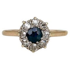 Edwardian 9 Karat Gold 0.32 Carat Sapphire 0.36ct Old Cut Diamond Cluster Ring