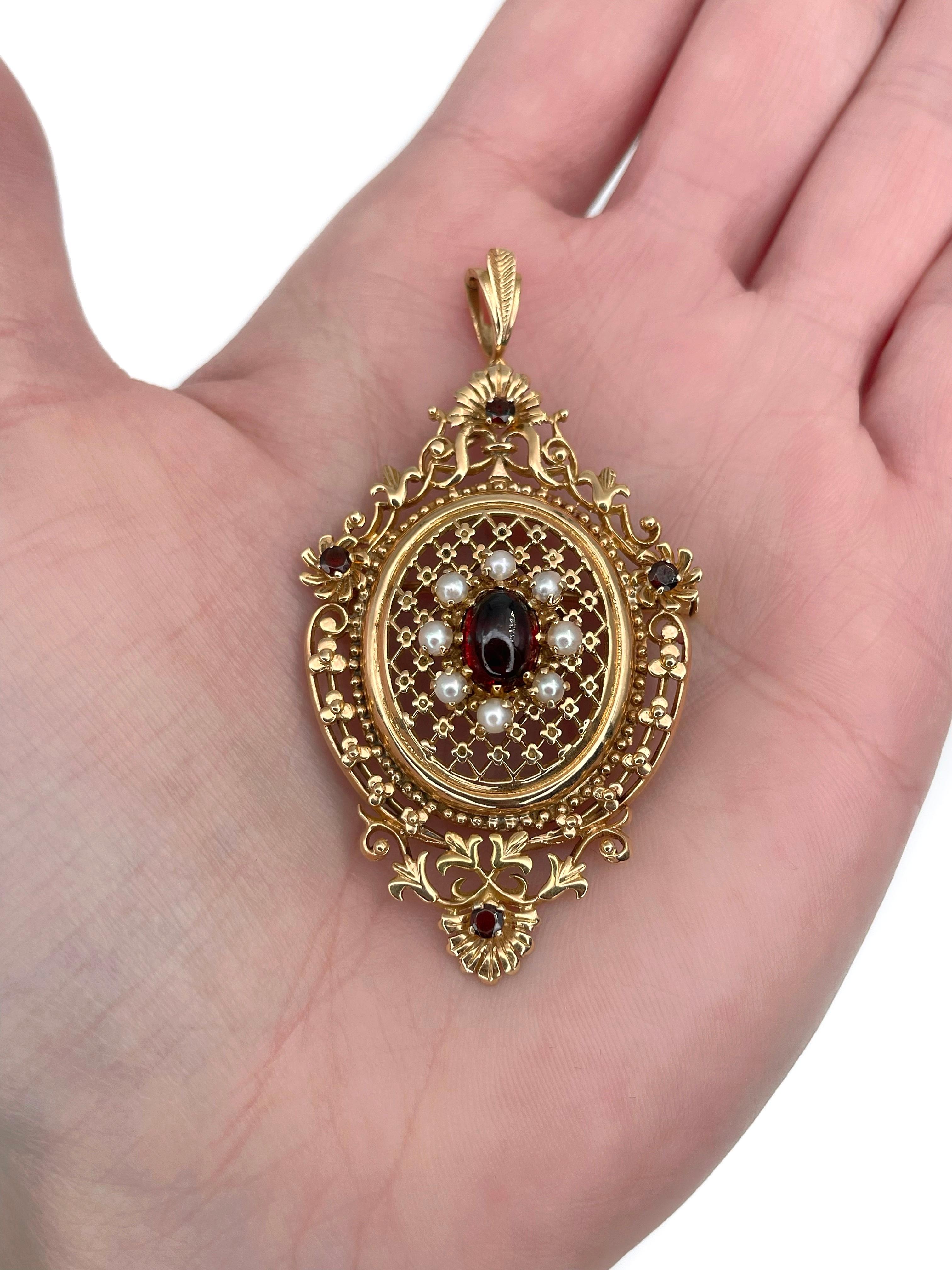 This is an Edwardian openwork pendant/brooch crafted in 9K yellow gold. Circa 1910.  

The piece features oval cabochon cut and round cut garnets. The central gem is surrounded with cultured pearls. 

The piece has a trombone clasp. 

Weight: