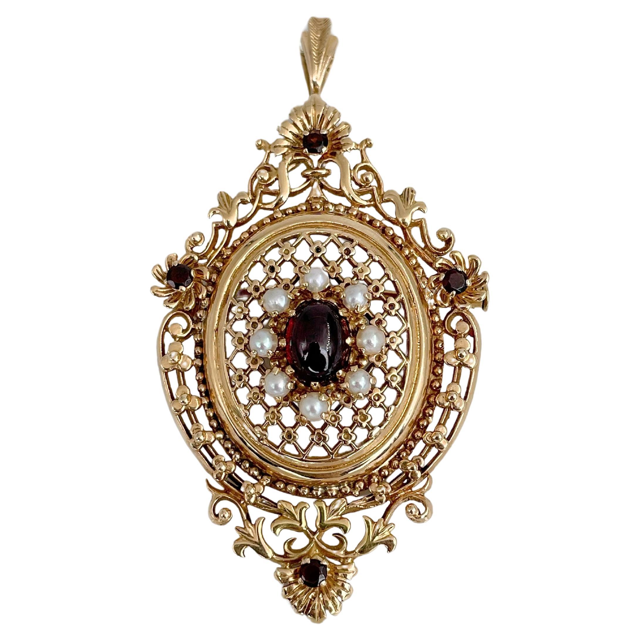 Edwardian 9 Karat Yellow Gold Garnet Pearl Openwork Pendant Brooch For Sale