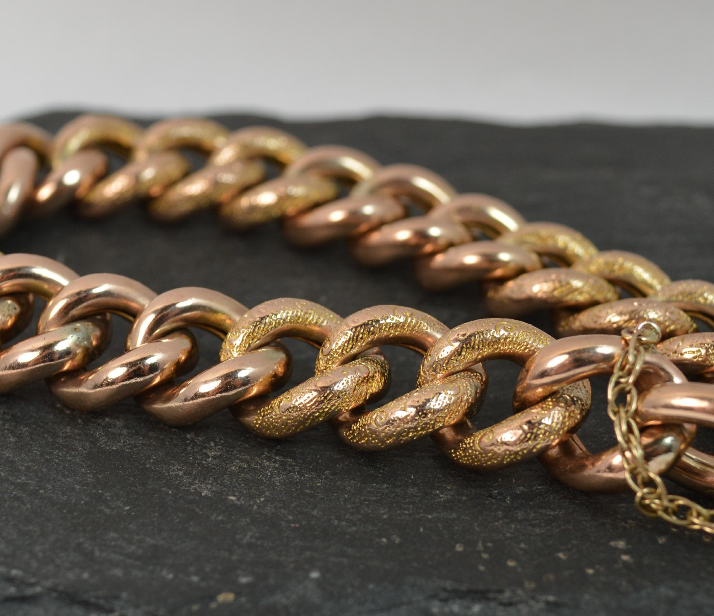 A superb Edwardian period bracelet.
Solid 9 carat rose gold piece.
Padlock clasp design.
​Curb shaped links with alternating plain and chased engraved sections.

CONDITION ; Good for age. Working padlock clasp and with safety chain. Crisp links.