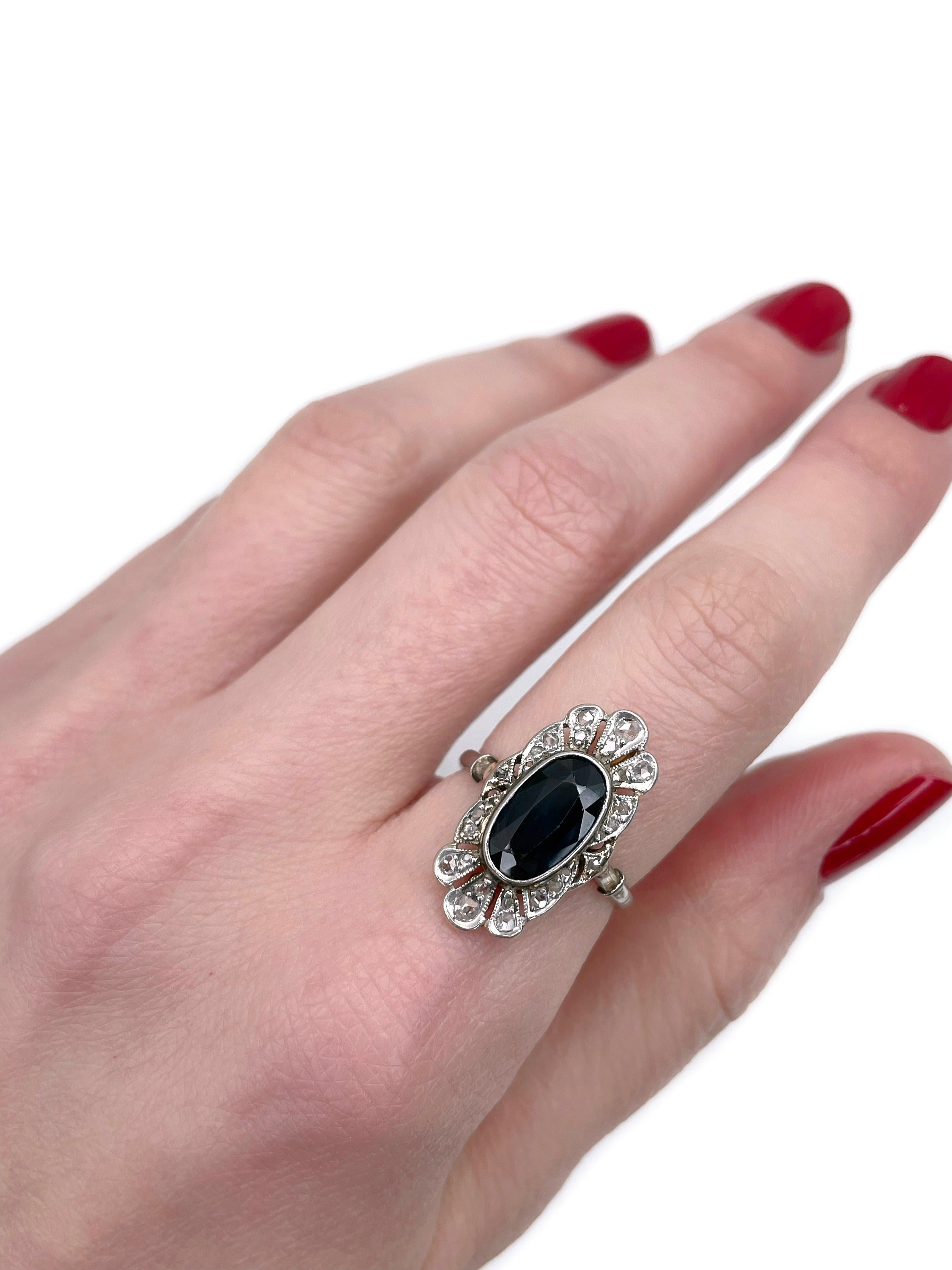 This is an Edwardian cocktail ring crafted in 950 platinum and 18K gold. Circa 1910. 

The piece features:
- 1 sapphire (oval cut, 2.00ct, B 8/4, VVS)
- 24 diamonds (rose cut, TW 0.10ct, RW-STW, SI-P1)

Weight: 3.86g
Size: 16.5 (US 6)

IMPORTANT: