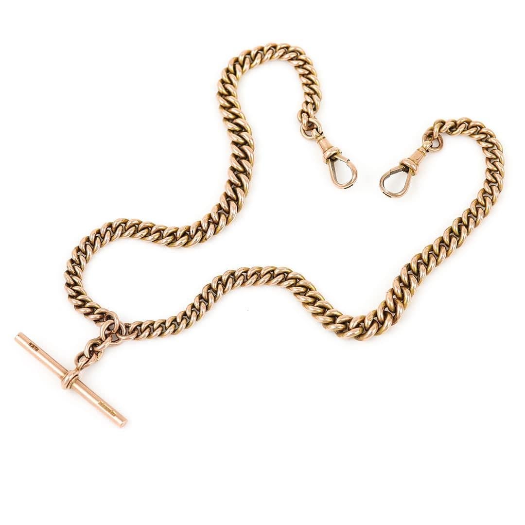 A solid, 9ct rose gold antique Edwardian Albert chain with graduated round curb links and a T-bar. Every link is stamped ‘9' '375', the two swivel clips and t-bar are also marked along with the makers mark. The Albert chain can be dated to circa