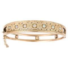 Antique Edwardian 9k Gold Cabochon Opal Engraved Bangle, Circa 1905