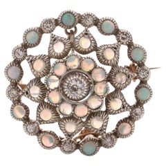 Antique Edwardian 9kt rose gold and silver round Opal and diamond brooch/pendant