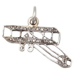 Edwardian airplane charm pendant by Cartier, 1910, patriotic charm