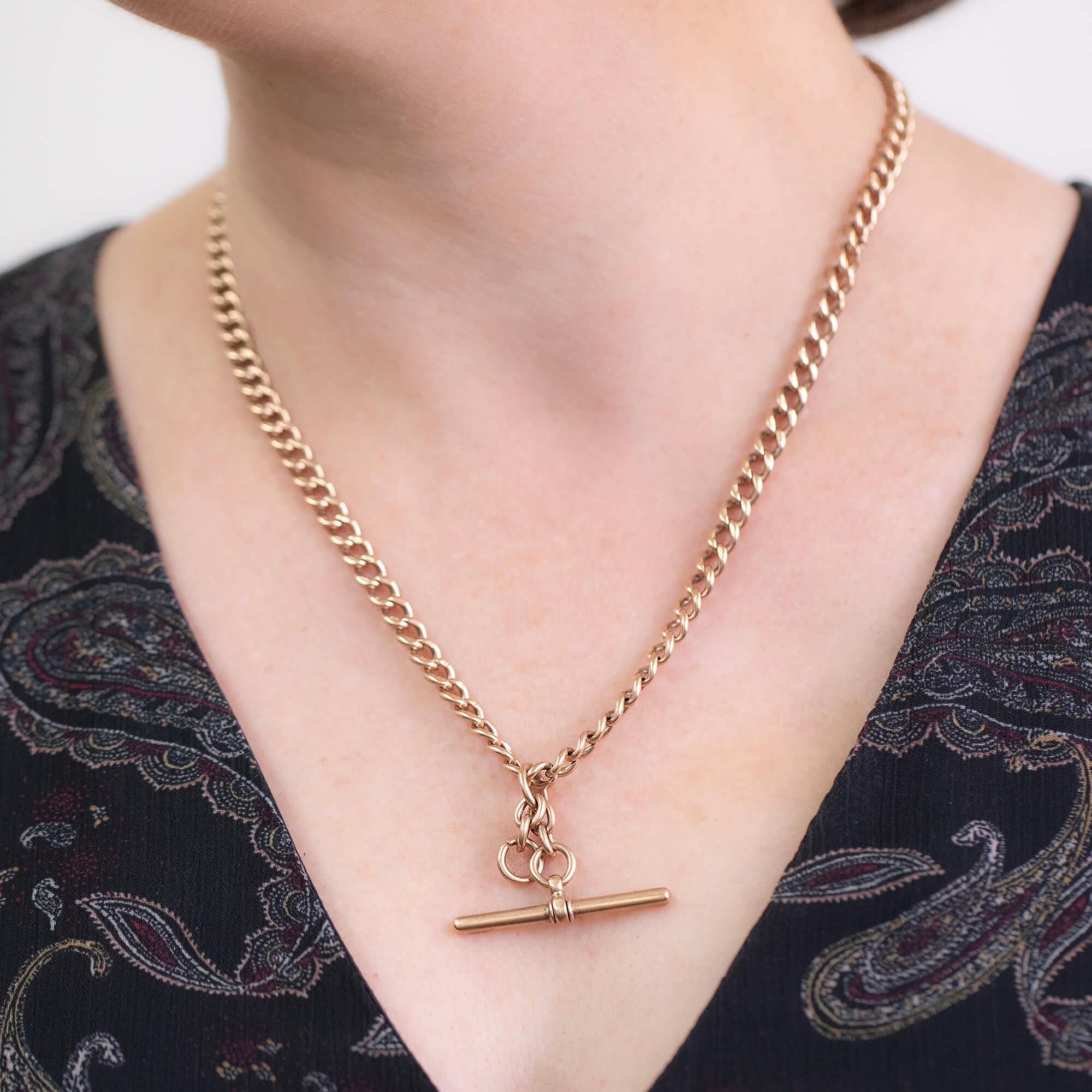 This solid 15k rose gold solid Albert fob watch chain is completely original with fob T-bar, extra chain drop and swivel catches. Hallmarked Birmingham 1900 with makers mark JG&S possibly John Goffe and son.

Metal: 15k rose gold
Length: Length 49cm