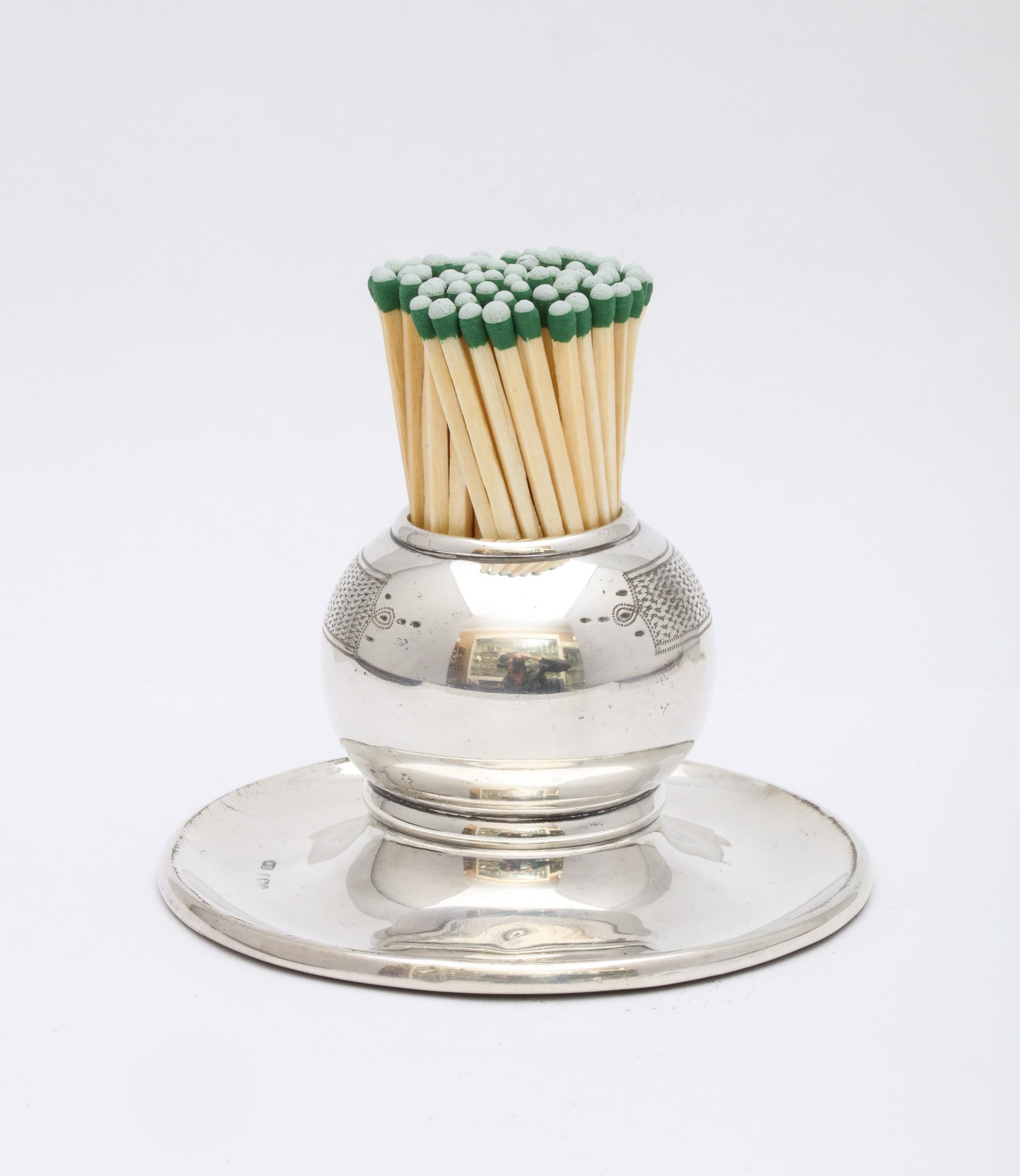 Edwardian, all sterling silver match striker on sterling silver base, Birmingham, England, 1901, William Devenport - maker. Weighted. Matches are struck on engine-turned portion of the match cup; base serves to hold used matches. Measures just under