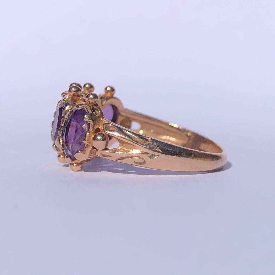 The style if this five stone ring has an almost Indian feel to it. the bright yellow 9ct gold next to the bright amethyst is gorgeous. The edges of the band has tiny orb detail and The shoulders have gorgeous detail. 

Ring Size: P or 7 1/2
Widest