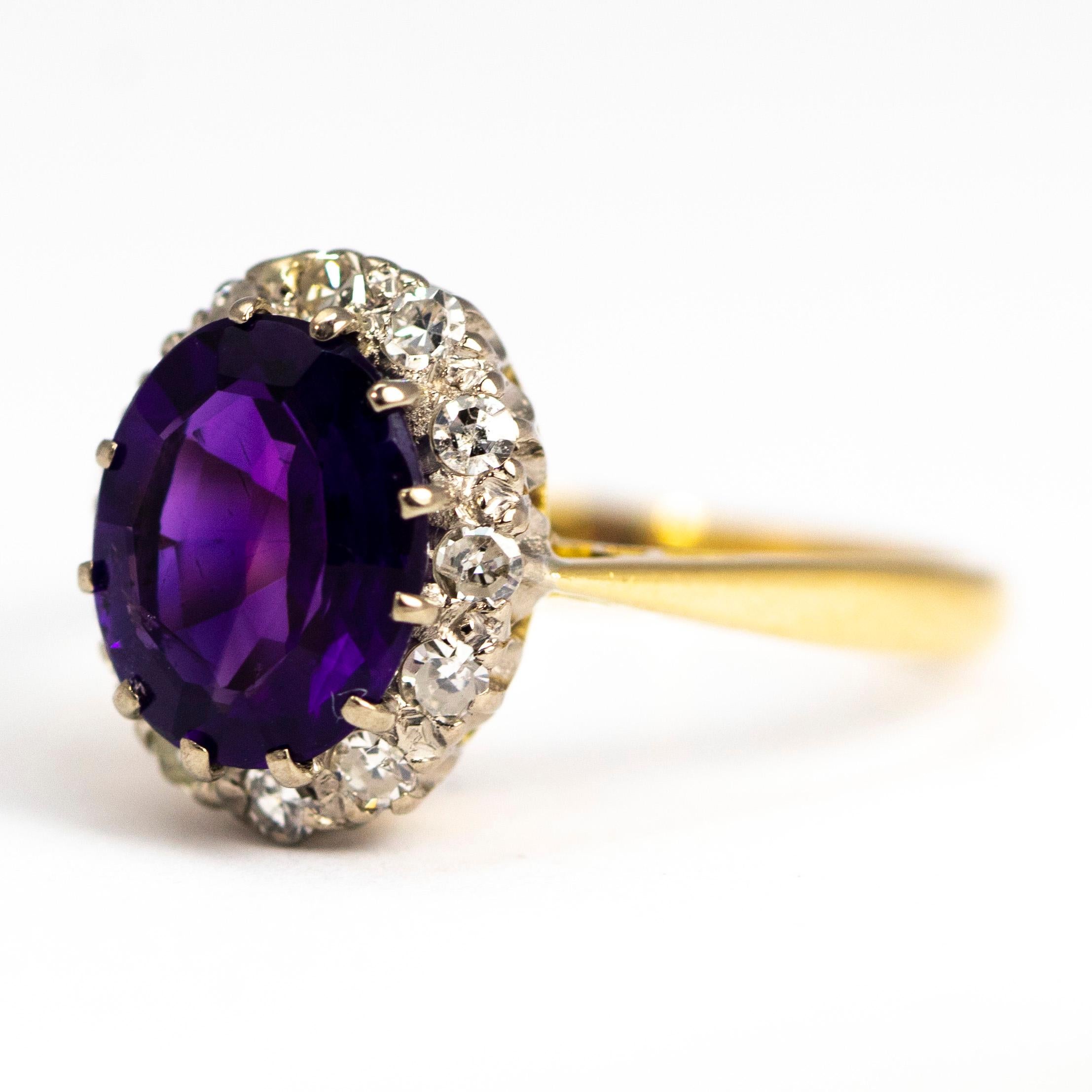 The stones in this ring are set in platinum and the rest of the ring is modelled in 18carat gold. The central amethyst measures approximately 2carats and is surrounded by shimmering old European cut diamonds. 

Ring Size: Q or 8 1/4 
Cluster