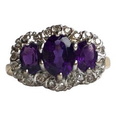 Edwardian Amethyst and Diamond 18 Carat Gold Triple Cluster Ring