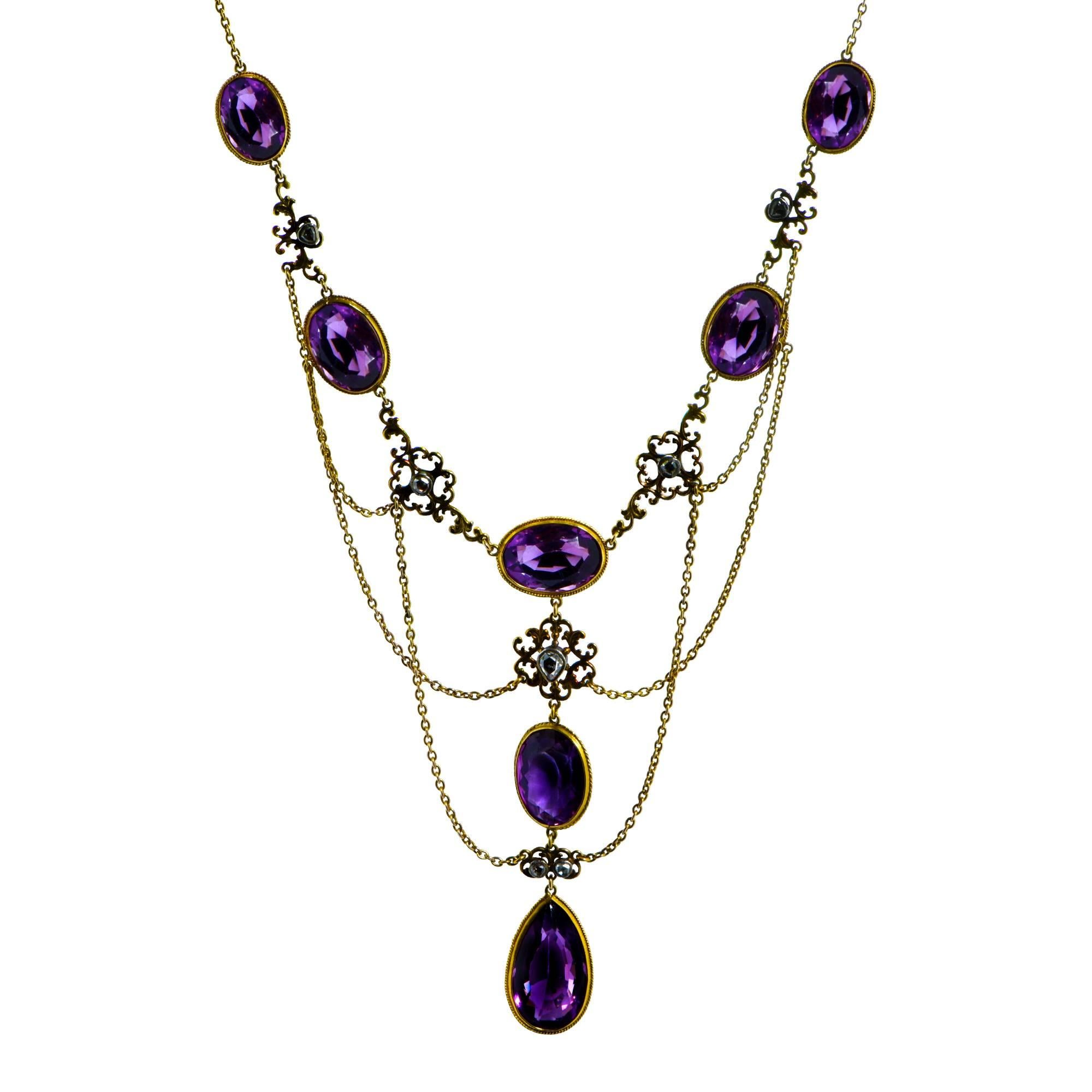 Magnificent Edwardian necklace and earring set crafted in 14 Karat Yellow gold adorned with 9 Rose Cut Diamonds J color, SI clarity weighing .50 carats total weight and 11 amethysts weighing 100 carats total weight  crafted in 14 karat yellow gold