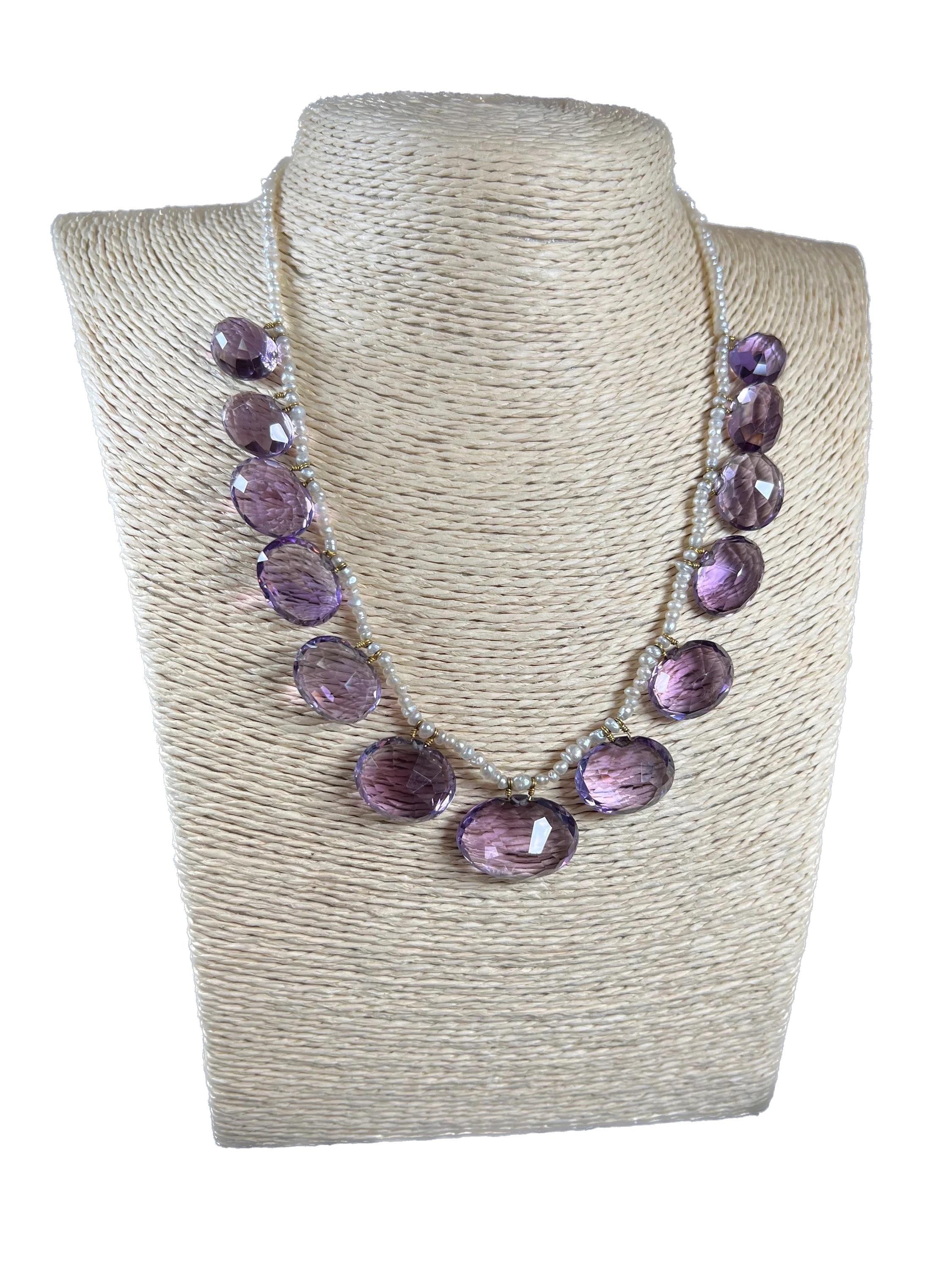 Antique Amethyst Necklace 

18ct Gold Clasp

Circa 1900

The most fabulous, Edwardian necklace. Beautifully threaded with natural seed pearls, suspended from which are thirteen, gorgeous, graduated amethysts. 
The amethysts are faceted & oval in