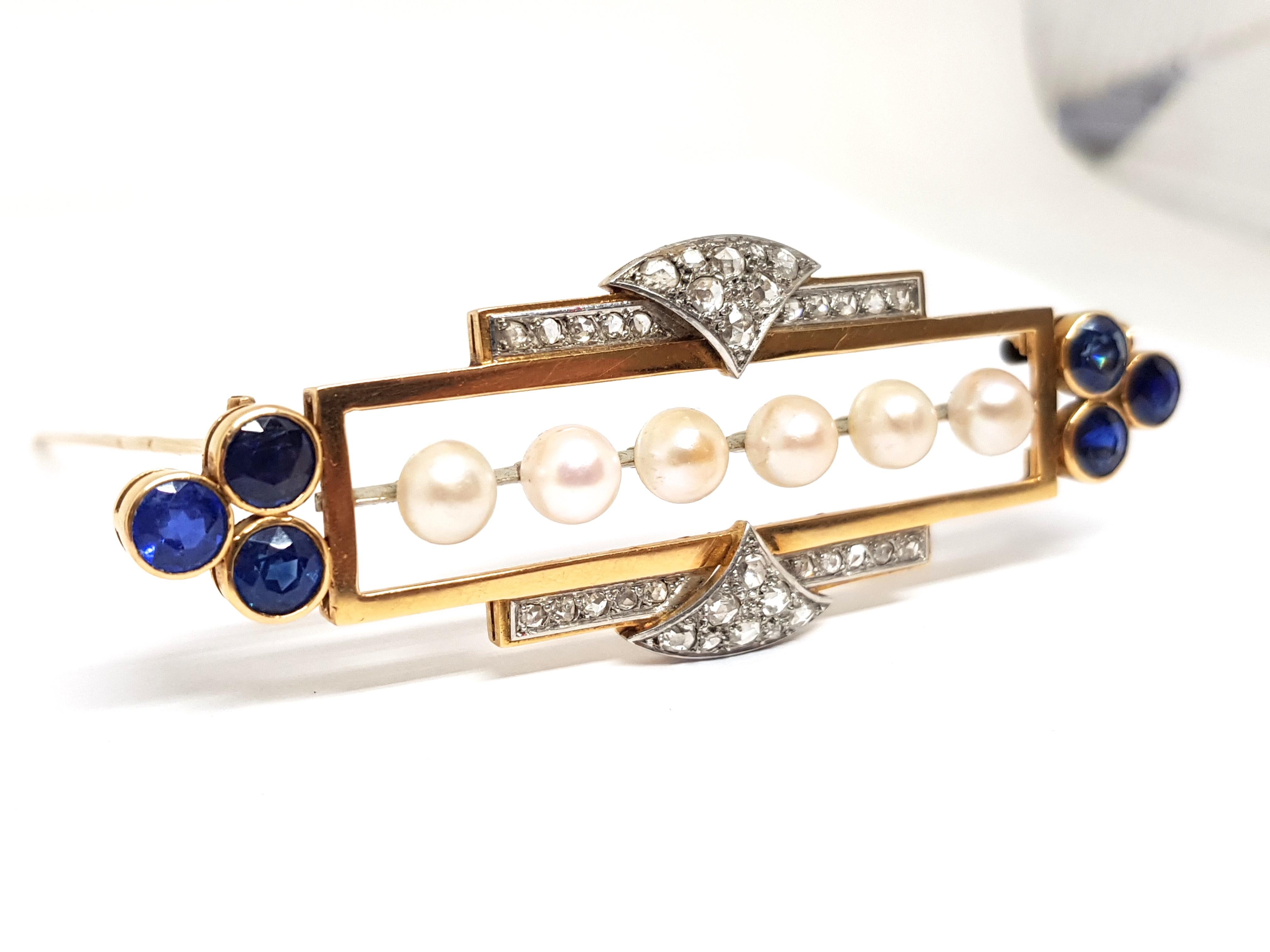 Edwardian Era Brooch
Gold: 18 Carat Yellow Gold 
Weight: 18.25gr. 
Diamonds: 1.20 ct. 
Blue Sapphires: 6.00ct. 
Pearls: 6 Natural pearls of 6mm each
Width: 8.0 cm. 
Length: 2.8 cm.
Shipping: free worldwide insured shipping 
All of our jewellery