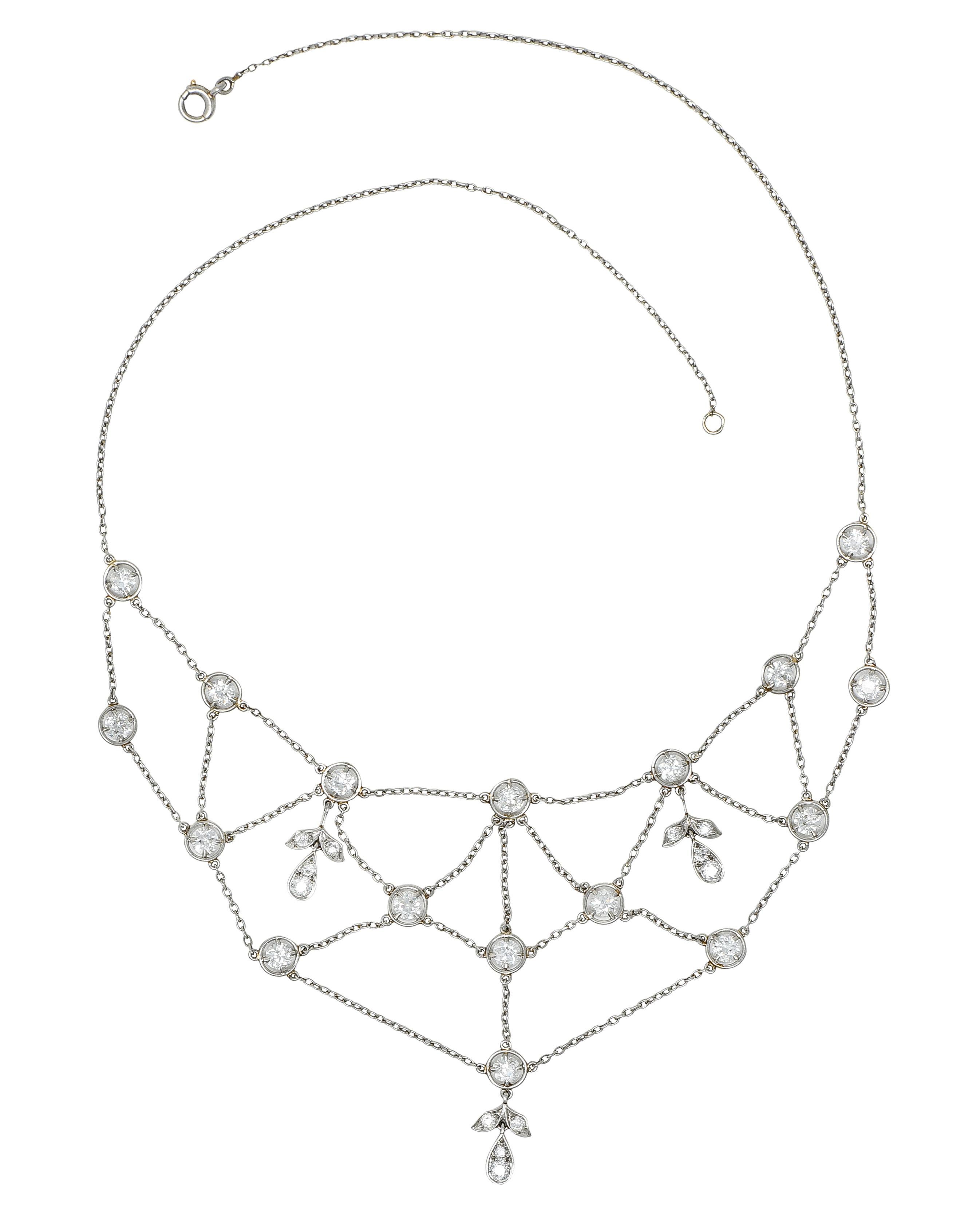Necklace is designed with circular diamond stations connected by swagged cable chain

Accented by three articulated foliate drops

Set with old European and transitional cut diamonds

Weighing in total approximately 3.40 carats - G to H color with