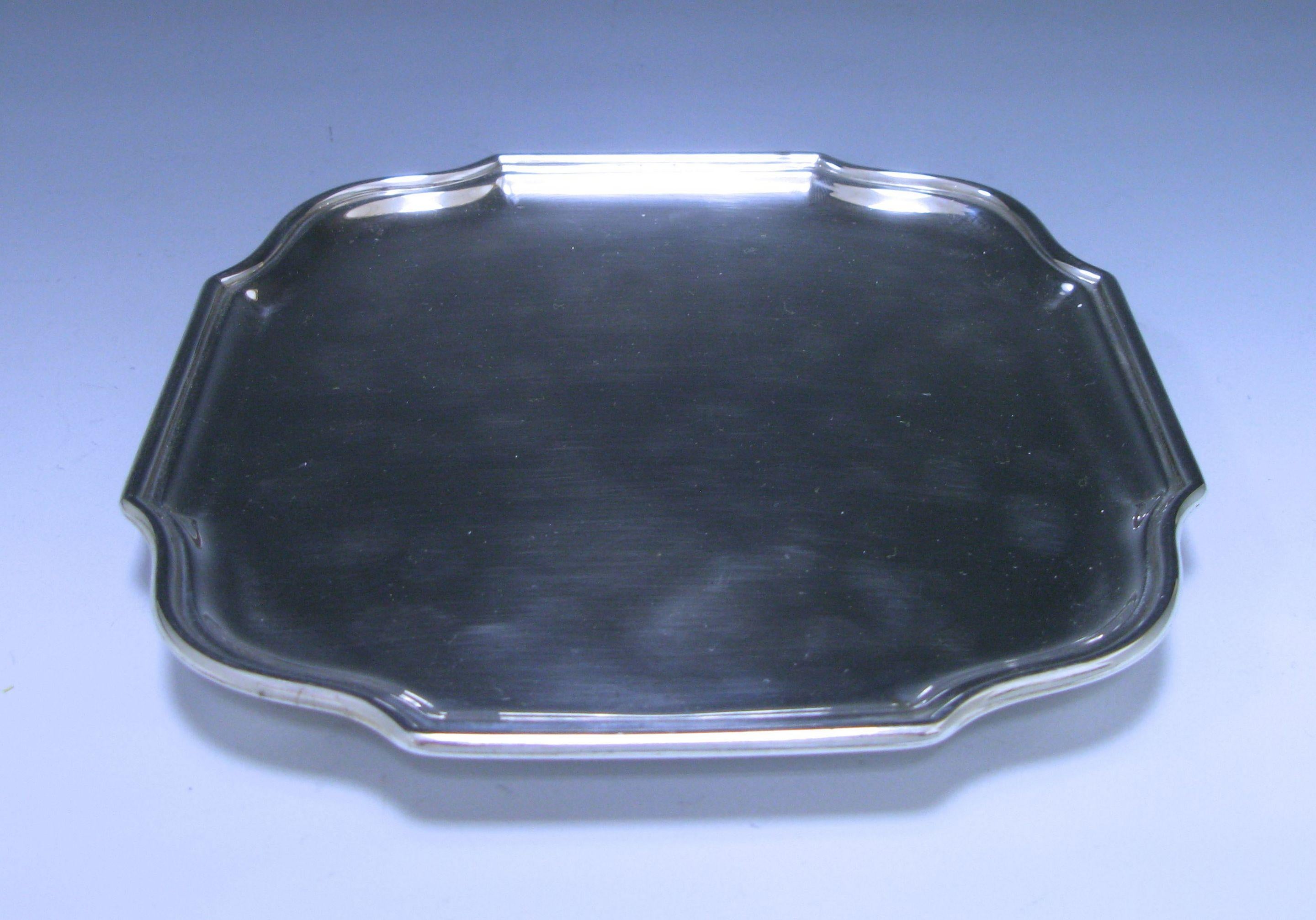 A delightful Edwardian antique sterling silver Salver of shaped square form standing on four ball feet. Measures: 7 x 7 inches, 17.78 x 17.78 cm.
 