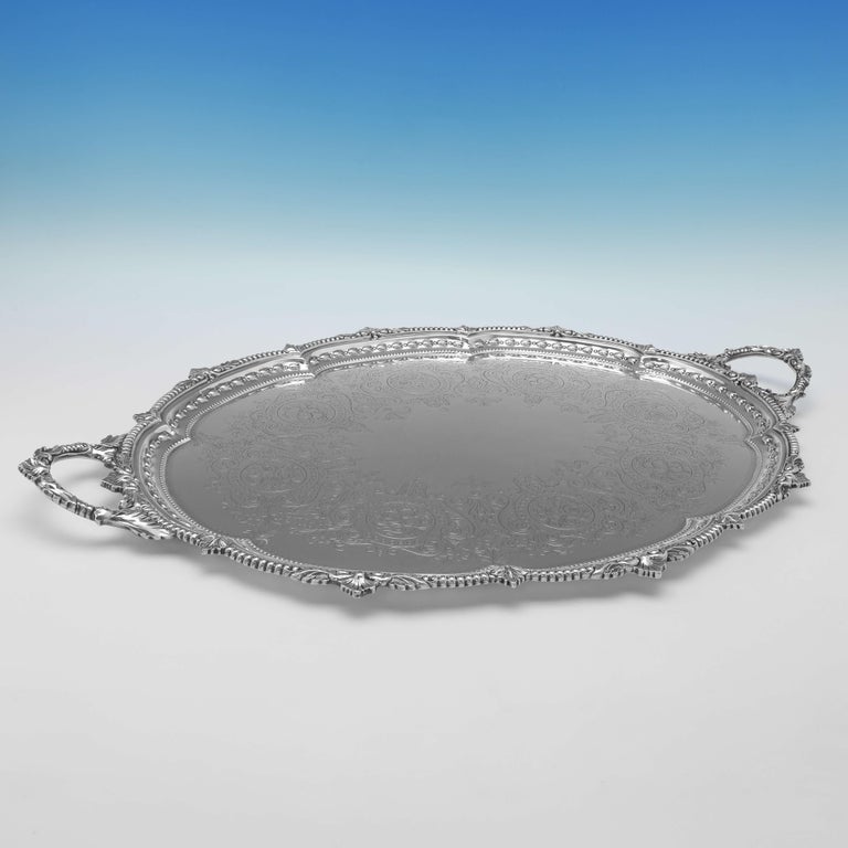 Hallmarked in Sheffield in 1902 by Mappin Brothers, this attractive, Edwardian, Antique Sterling Silver Tray, features an engraved centre and an ornate double border. 

The tray measures 1.75