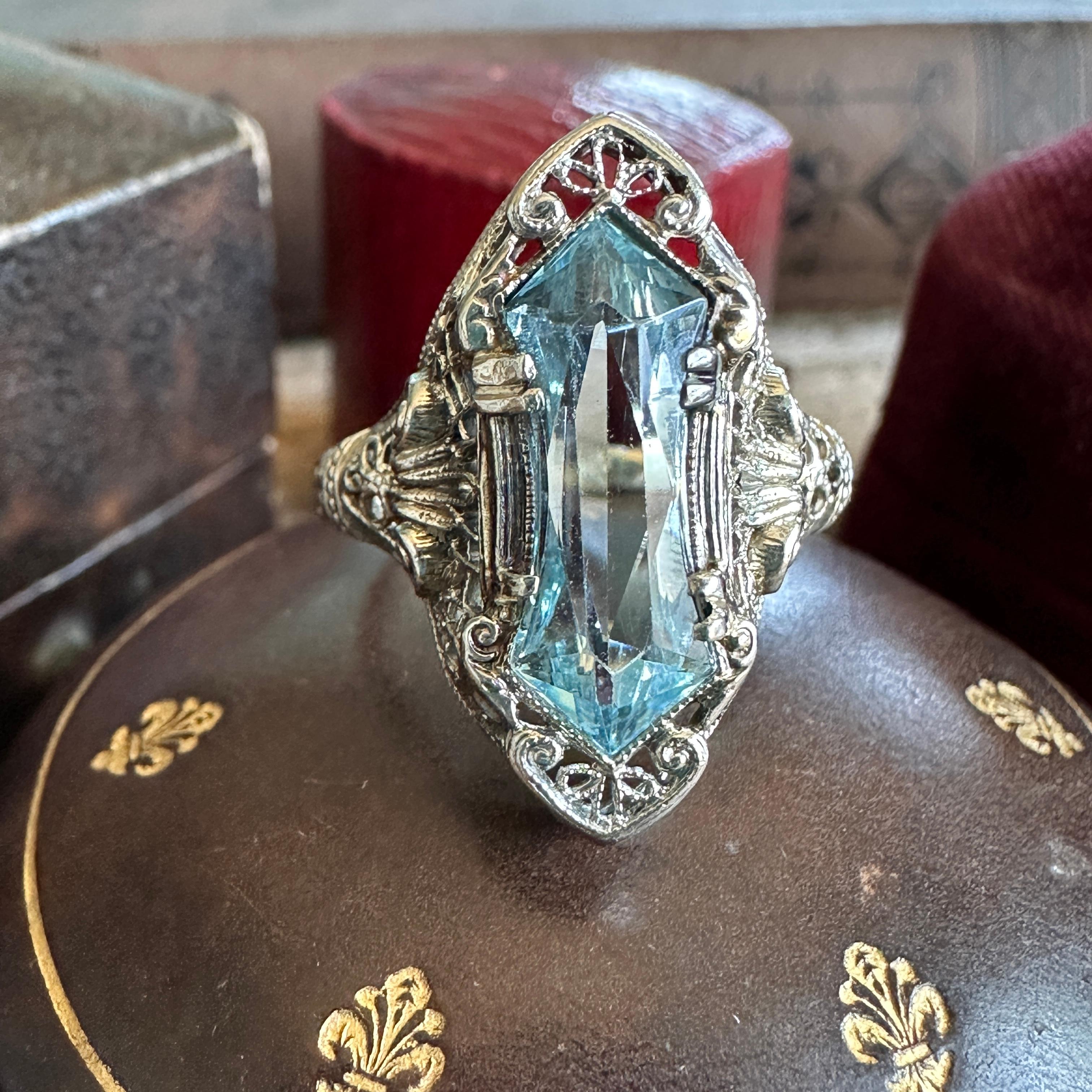 Details: 
Fabulous Edwardian Aquamarine & Diamond 14K white gold filigree ring. The filigree is magnificent, with very detailed work, including engraving on the sides of the band. The craftsmanship is superb, and the setting is in near perfect