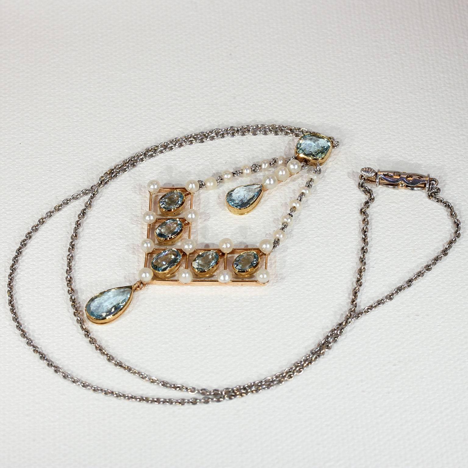 This elegant antique Edwardian aquamarine and pearl necklace was handcrafted by the well known firm of ’Asprey’, in London around 1910. It’s a breathtaking piece with eight aquamarines, one square cut, two pear cuts, and five oval shaped stones,
