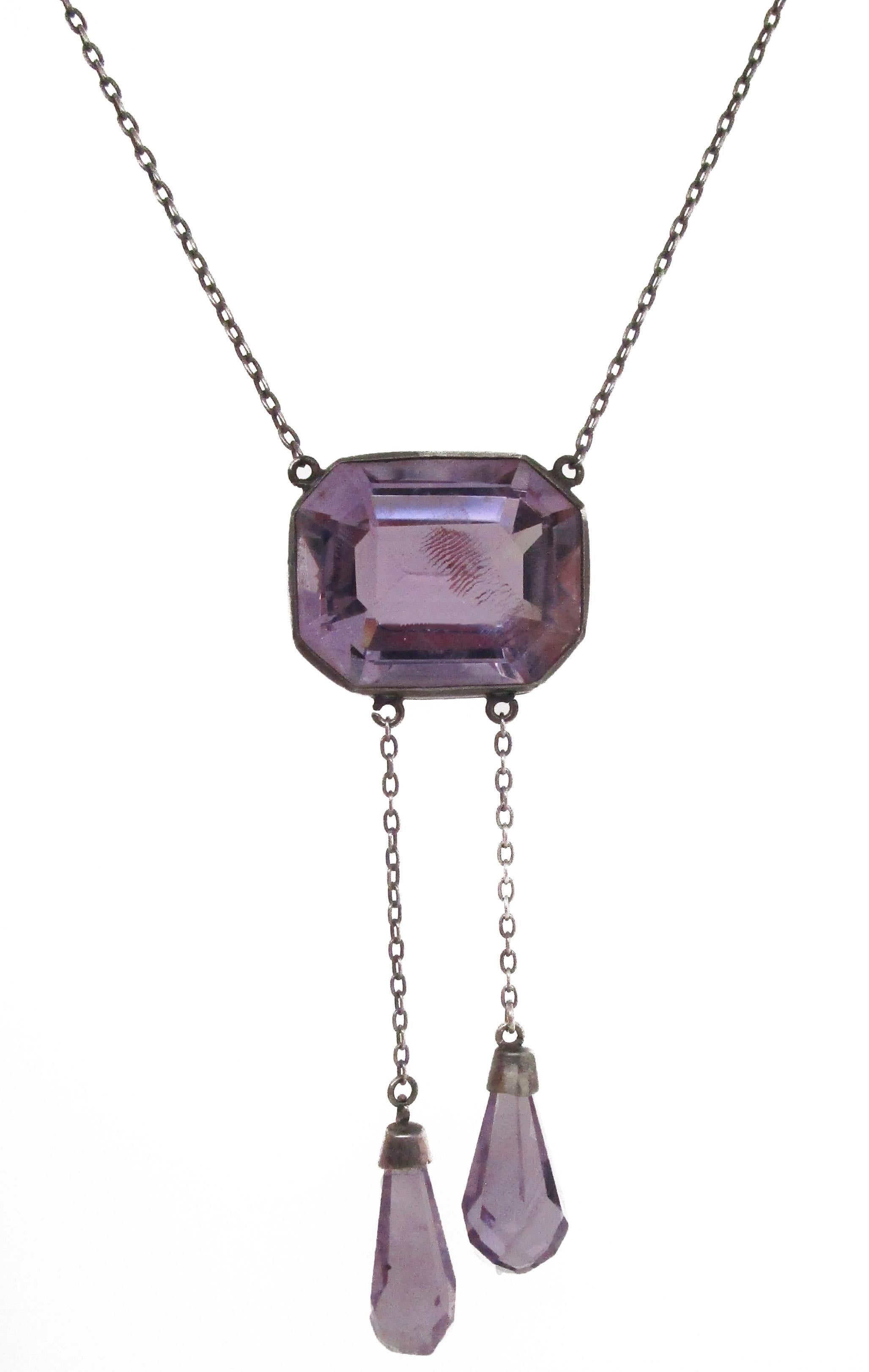 This absolutely stunning Edwardian Austrian negligee necklace brings together the soft natural beauty of Rose de France amethyst and bright sterling silver in a gorgeous necklace with delicate briolette dangle accents. The center stone of the