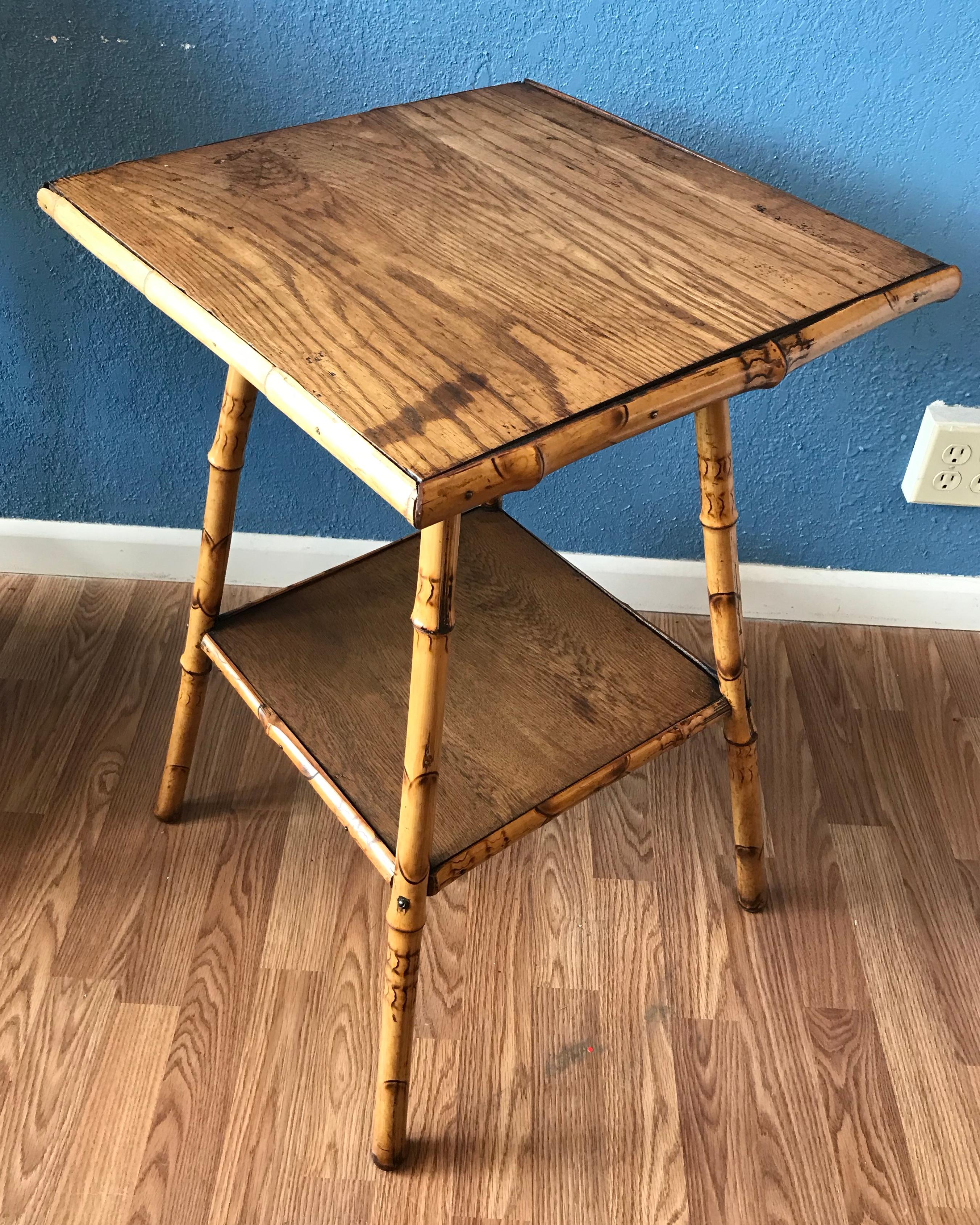 This sturdy English table is designed with
an oak top and corresponding oak bottom
shelf. Good scale and design.