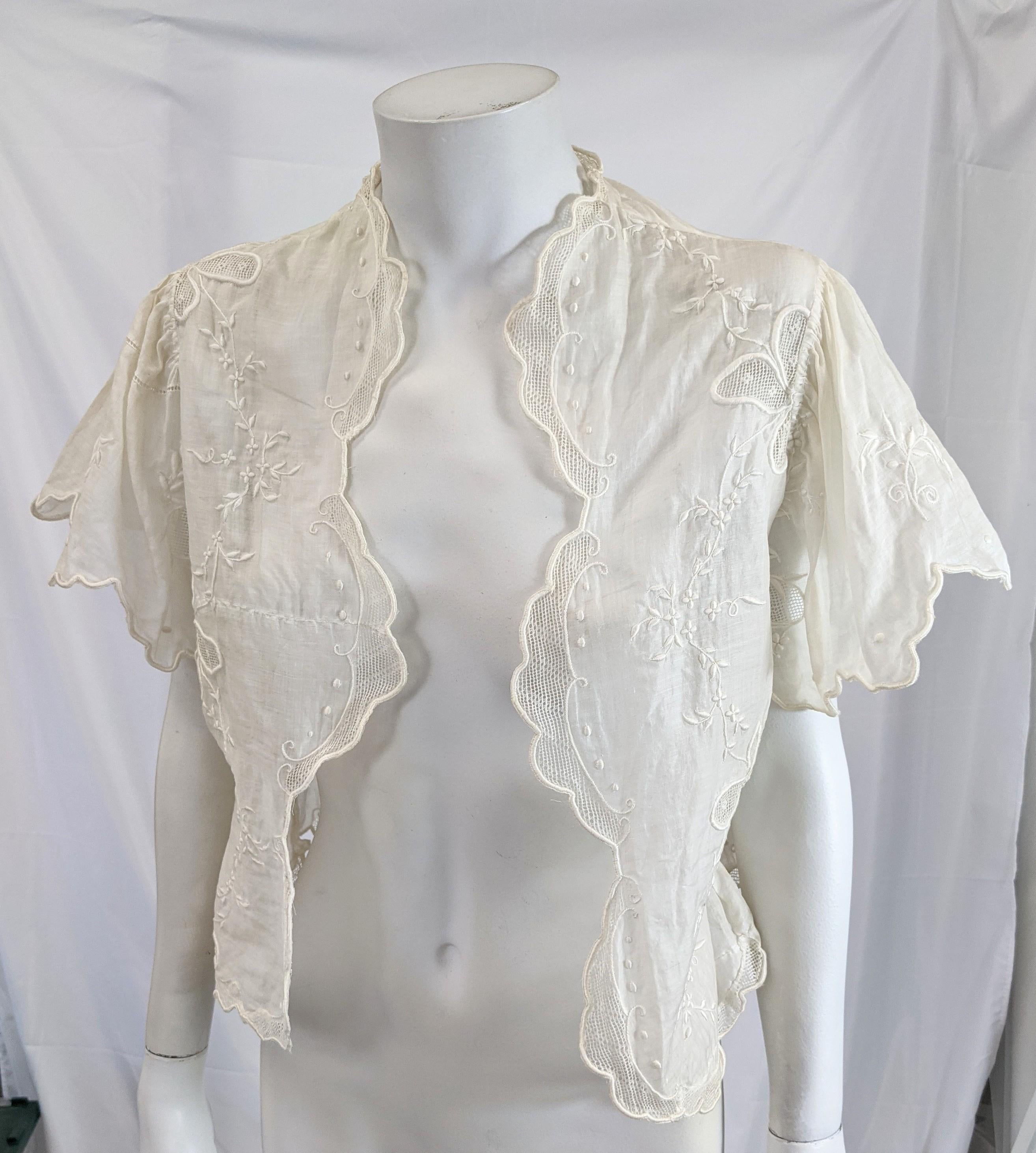 Edwardian Batiste Embroidered Bolero with flutter sleeves, with embroidery and openwork clover motifs. Made possibly from an older piece with unusual seaming.
Cotton Batiste 19