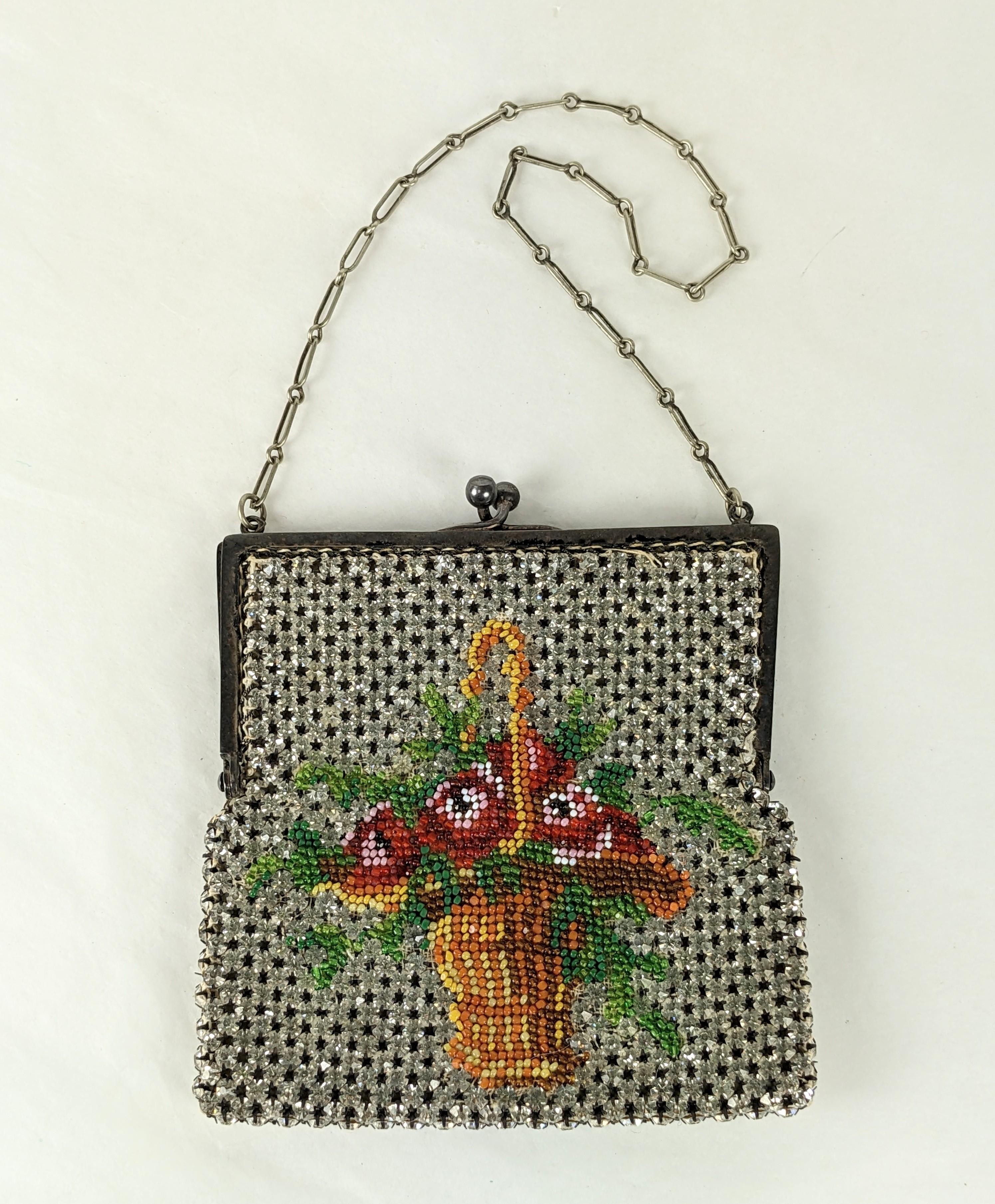 Charming Edwardian Beaded Crystal Evening  Purse from the early part of the 20th Century. Elaborate bead work depicting a flower basket is set on a base of crystal pastes hand set in mesh. Lined in original chamois leather. 1915 France. 
Purse 4