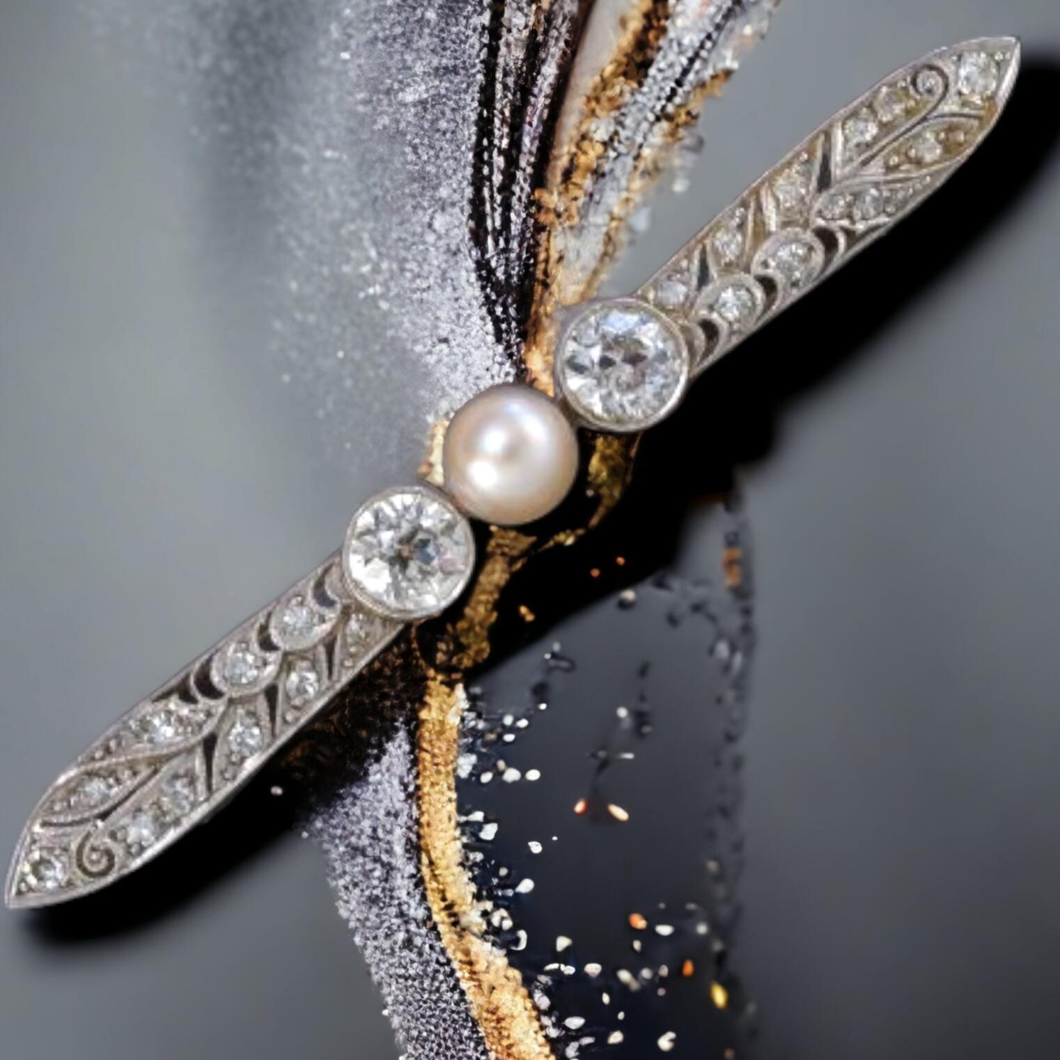 Edwardian (Belle Epoque) Diamond and  Pearl Bar Brooch (Early 20th C)

Strikingly distinctive Edwardian-era beauty, expertly hand fabricated in platinum over 18K yellow gold during the  first decade of the twentieth century, measures just a smidgen