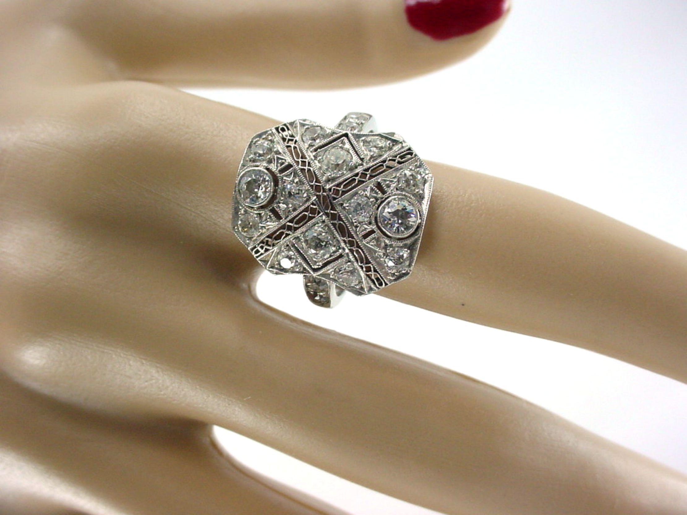 Lacy, lyrical, lovely… This light and airy Edwardian period ring has a rich Belle Époque feel. Platinum set with old cut diamonds create a shield shape. 

The lively old cut diamonds are well-matched, show white and are eye-clean, together they
