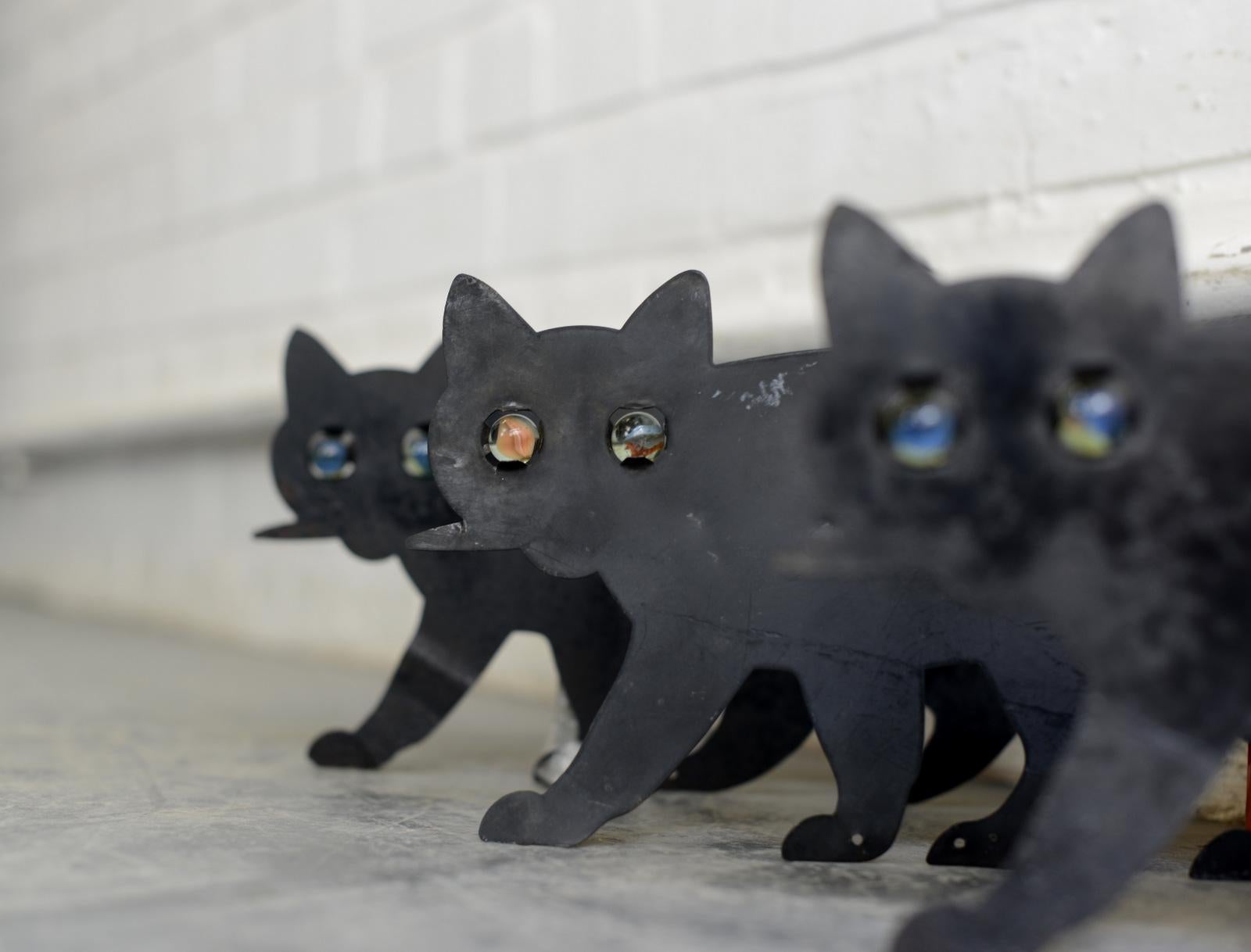 Edwardian black cat bird scarers, circa 1910.

- Price is per piece
- Made from tin
- Glass marble eyes
- English, 1910
- Measures: 18cm tall x 36cm long.

Condition report:

Cleaned and lightly waxed.