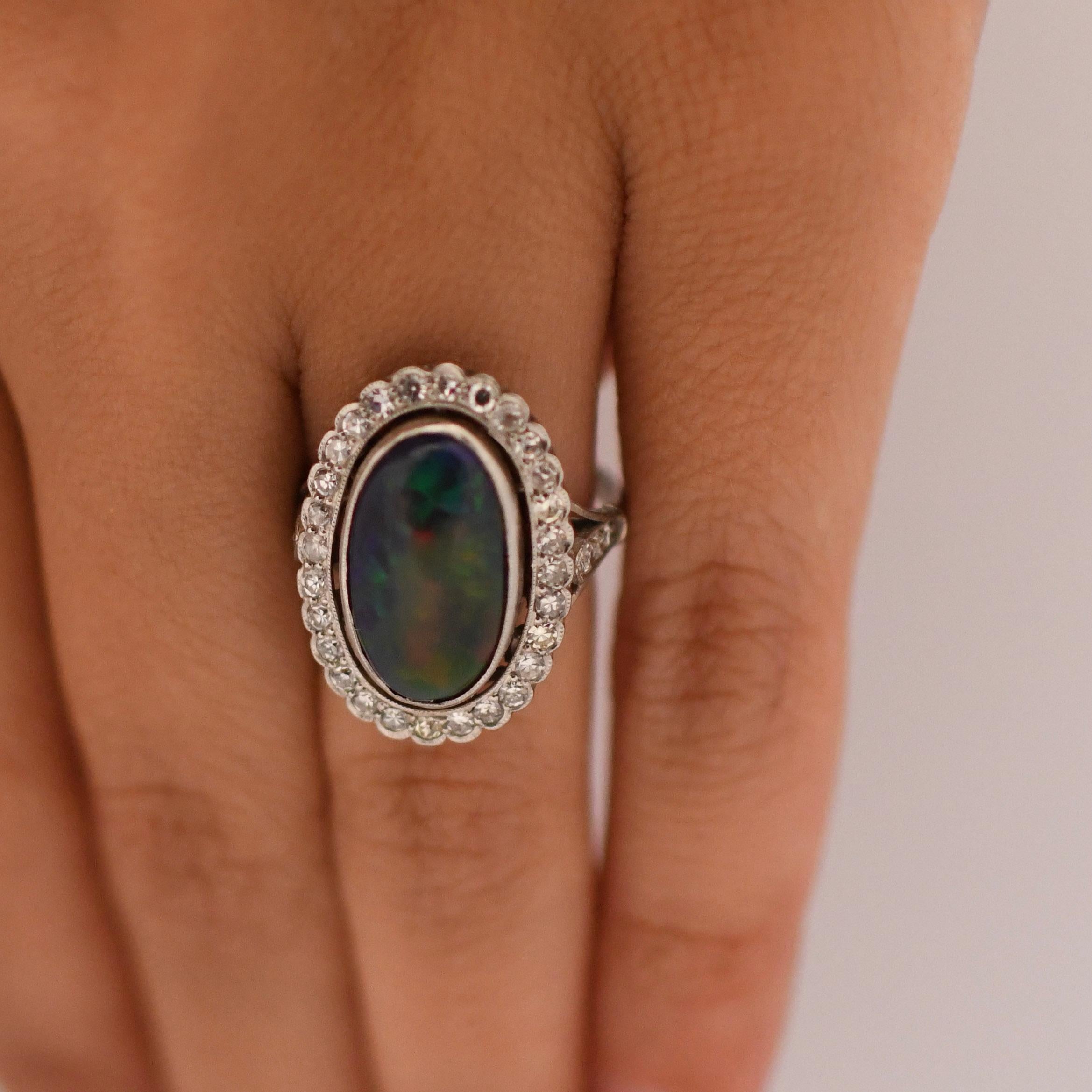 Women's Edwardian Black Opal Cabochon and Diamond Halo Vintage Platinum Ring For Sale