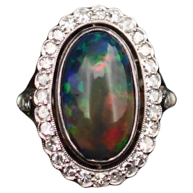 Platinring mit schwarzem Opal, Cabochon und Diamant-Halo im viktorianischen Edwardianischen Stil