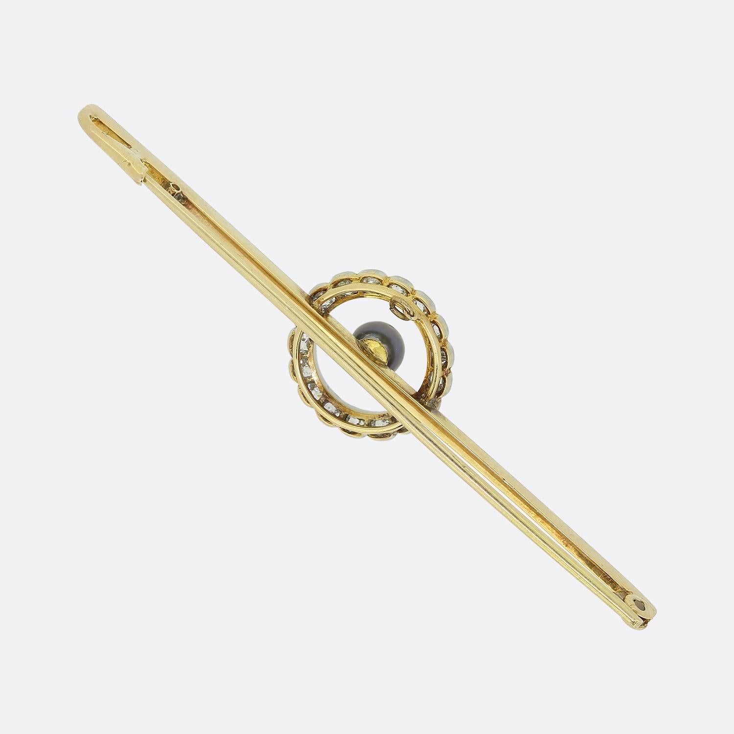 Here we have a charming bar brooch dating back to the Edwardian era. The bar itself has been crafted from 18ct yellow gold and tipped in platinum. The circular motif at the centre has been set with a row of round faceted old mine cut diamonds around
