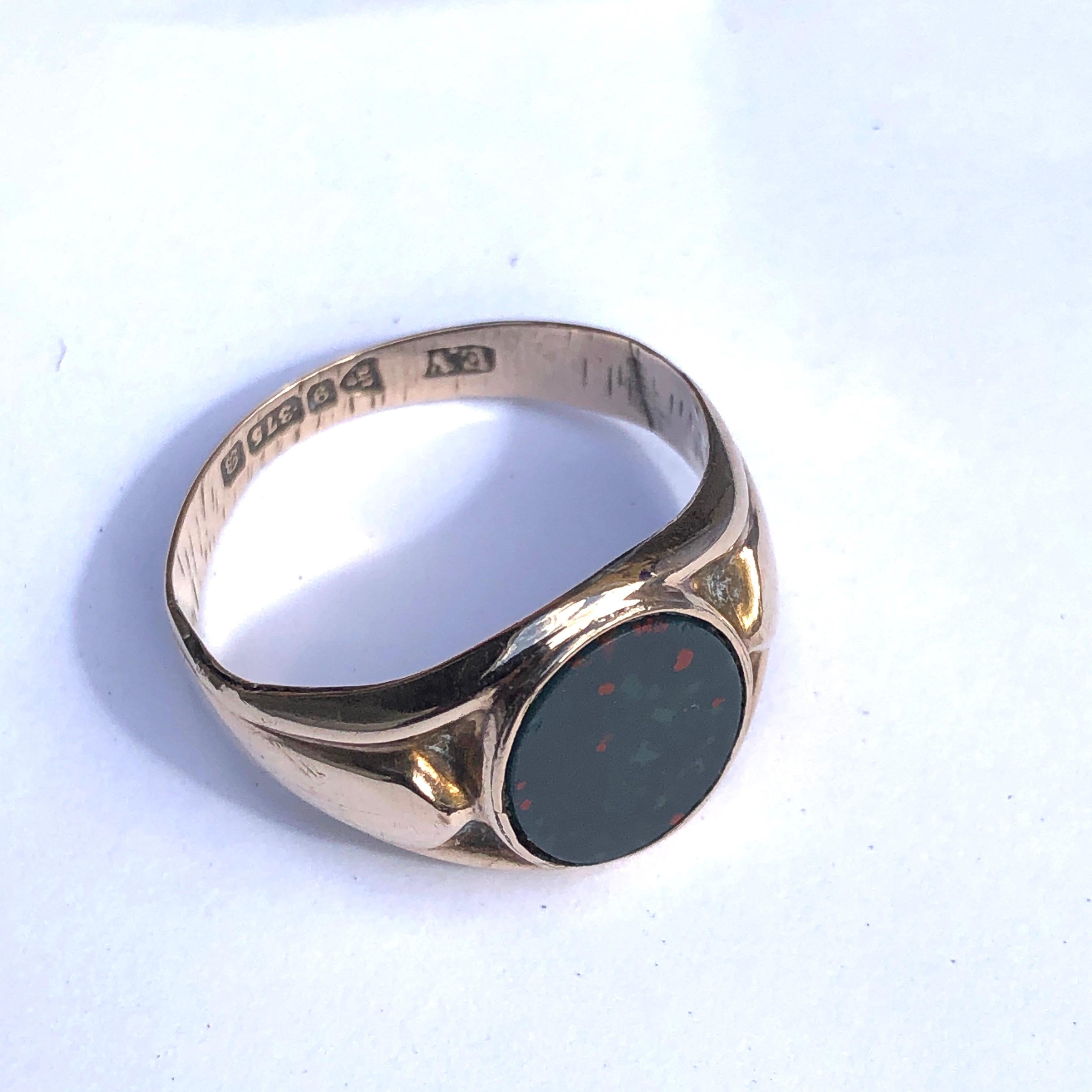 The slightly oval bloodstone set within this ring is a lovely rich and deep green colour with the bright red flecks as you would expect from a bloodstone. The ring itself is modelled in smooth and glossy 9ct gold and almost resembles folded fabric.