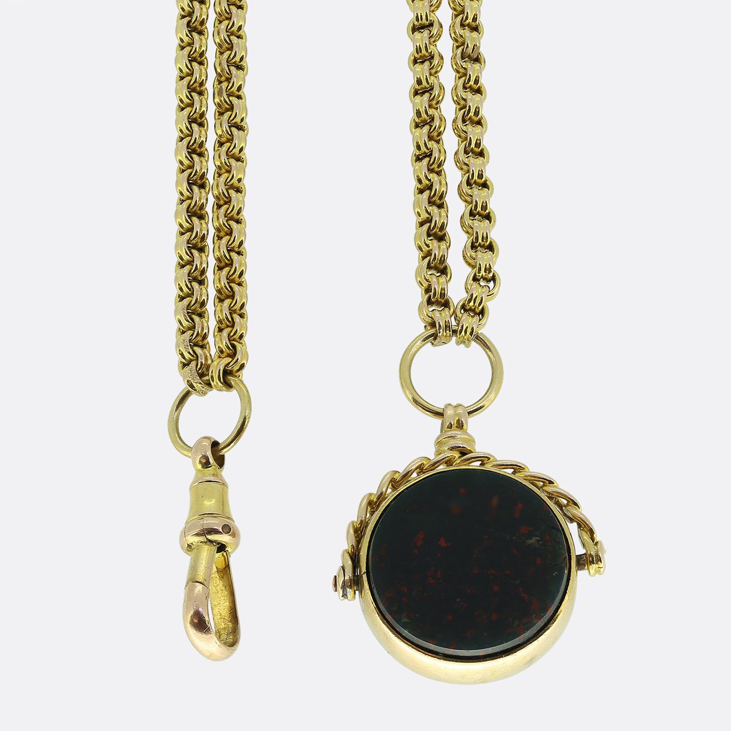 Here we have a chic and stylish spinning fob necklace. Each aspect of this piece dates back to the Edwardian period with the rotating pendant playing host to a round shaped bloodstone on one side and a carnelian disc on the reverse; both of which