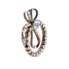Edwardian Blue Zircon & Mine Cut Diamond Ribbon Motif Pendant Circa 1900