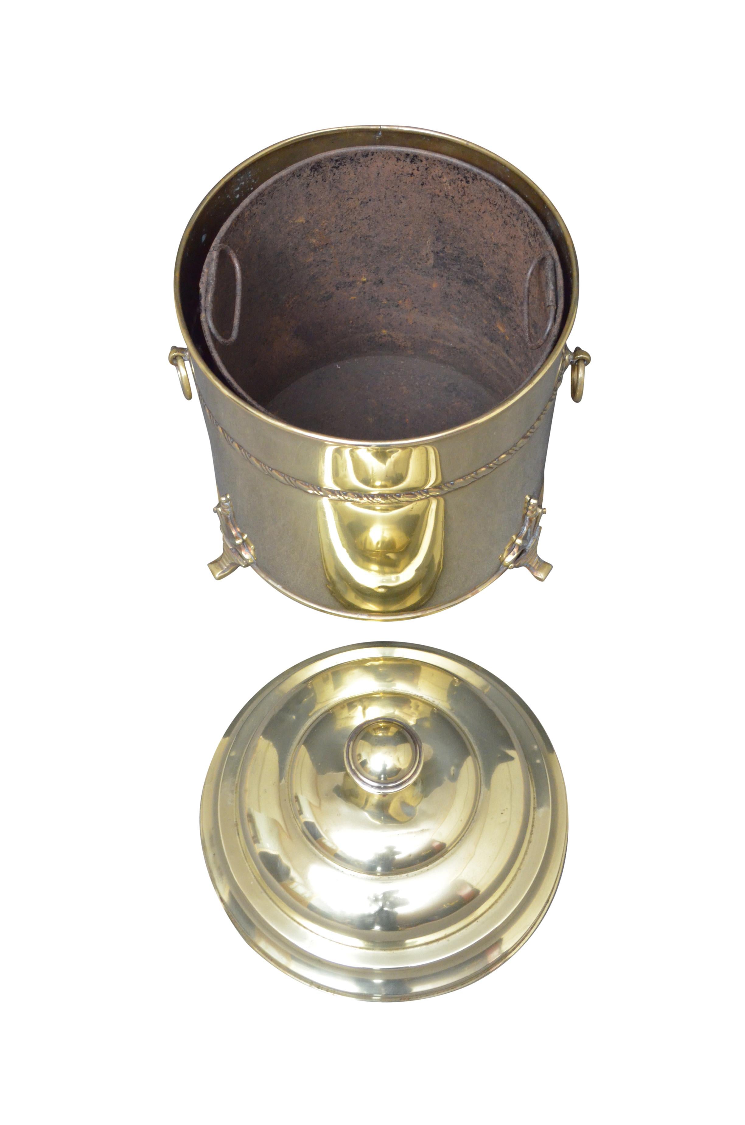 k026 Edwardian brass coal bin with lift up lid , original liner, decorative band, carrying handles and decorative feet. This coal bucket would make a perfect planter / jardinier, it has been cleaned and polished and it is ready to use at home. c1900