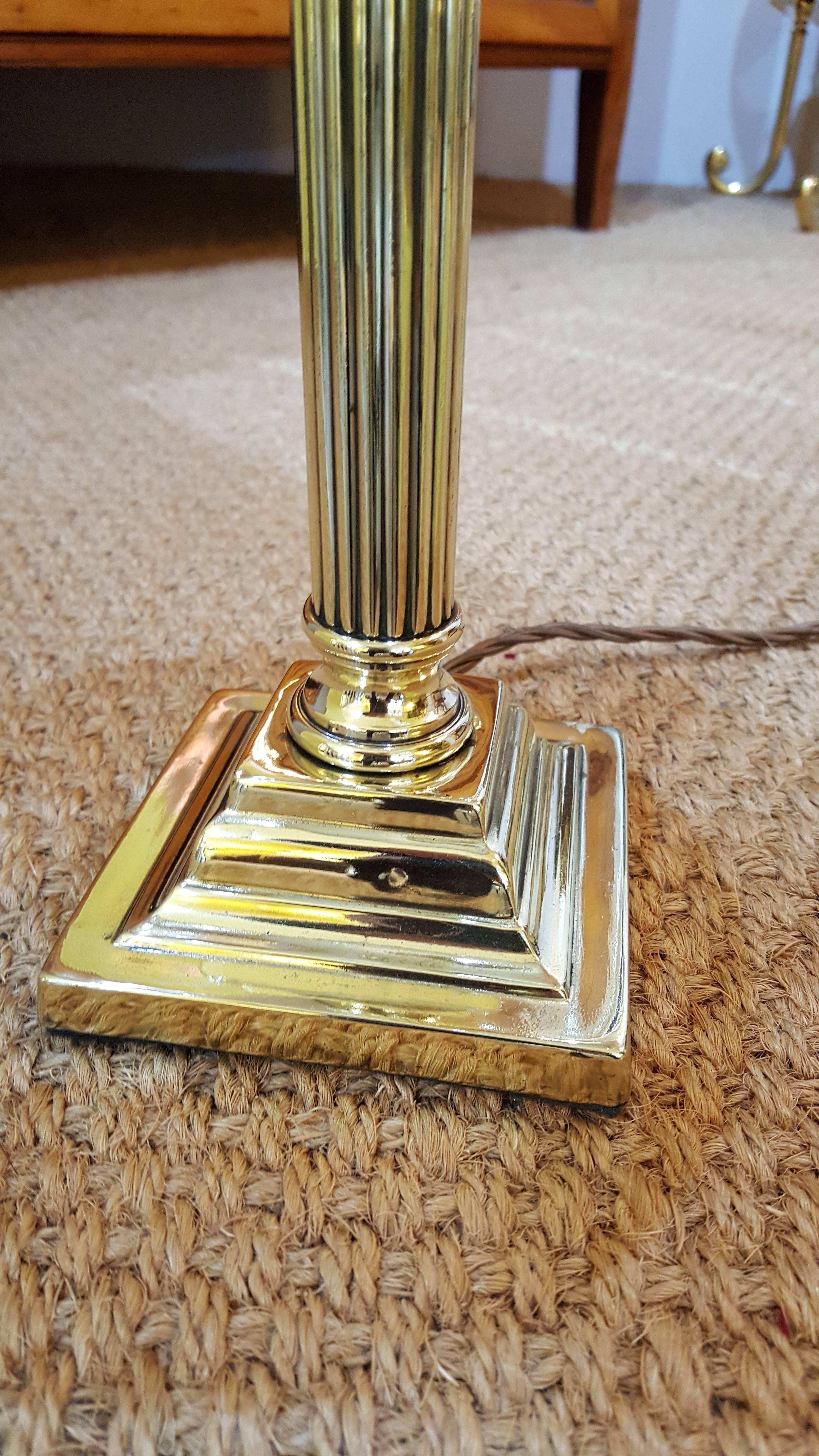 Edwardian brass table lamp in the form of a Corinthian column on a stepped platform base, all lights and lamps have been rewired with authentic corded flex, fitted with either foot switch or finger clicker switch and are Pat tested
Measure: 7