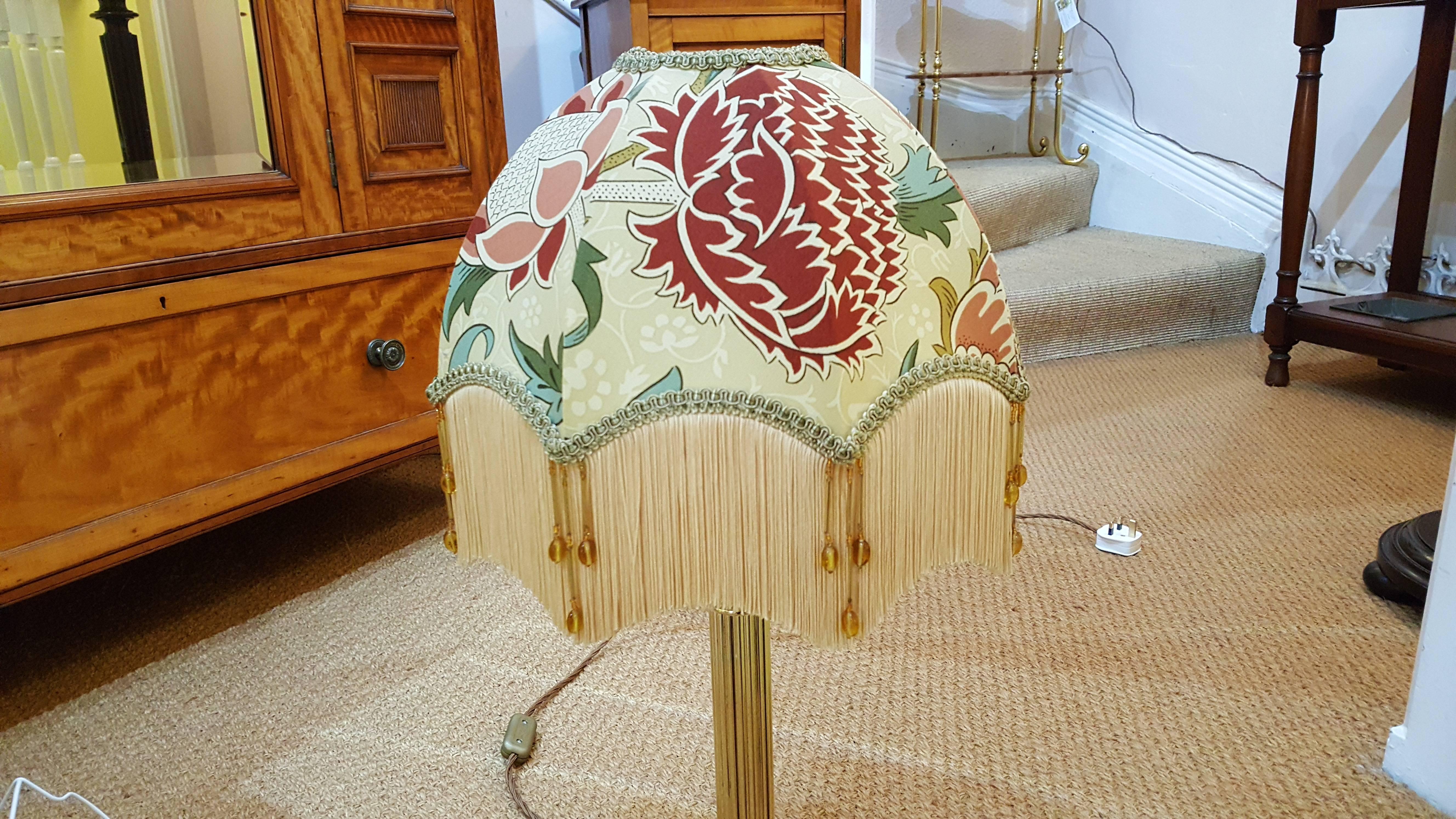 Edwardian brass table lamp in the form of a Corinthian column on a stepped platform base, the lampshade(s) are newly handmade silks by the same maker as provides the shades for Downton Abbey, all lights and lamps have been rewired with authentic
