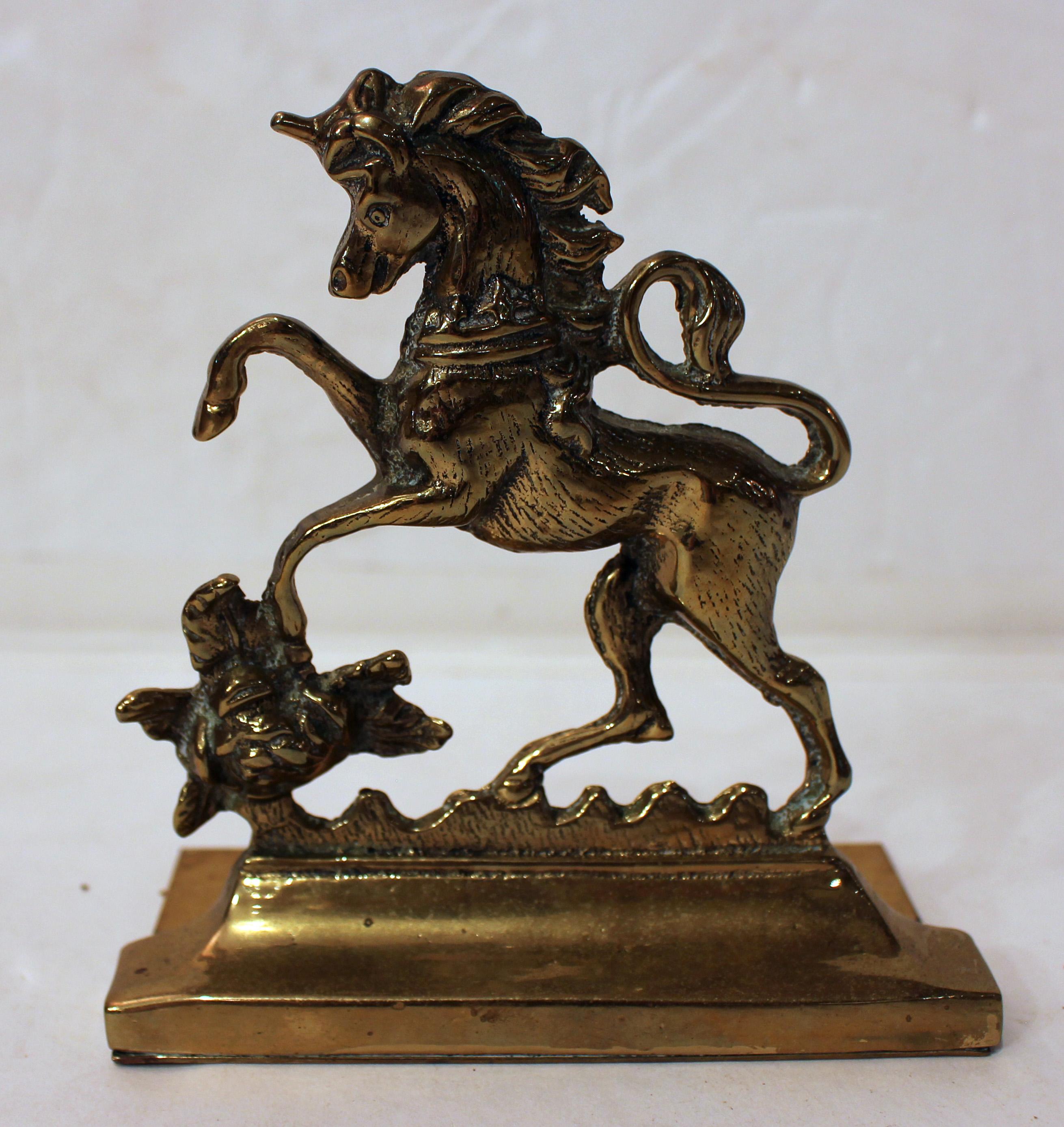 Edwardian period pair of brass bookends, English. Featuring the lion & unicorn, the supporters of the English Royal Crest. Provenance: Estate of Katharine Reid, former director Cleveland Museum of Art.
5 1/2
