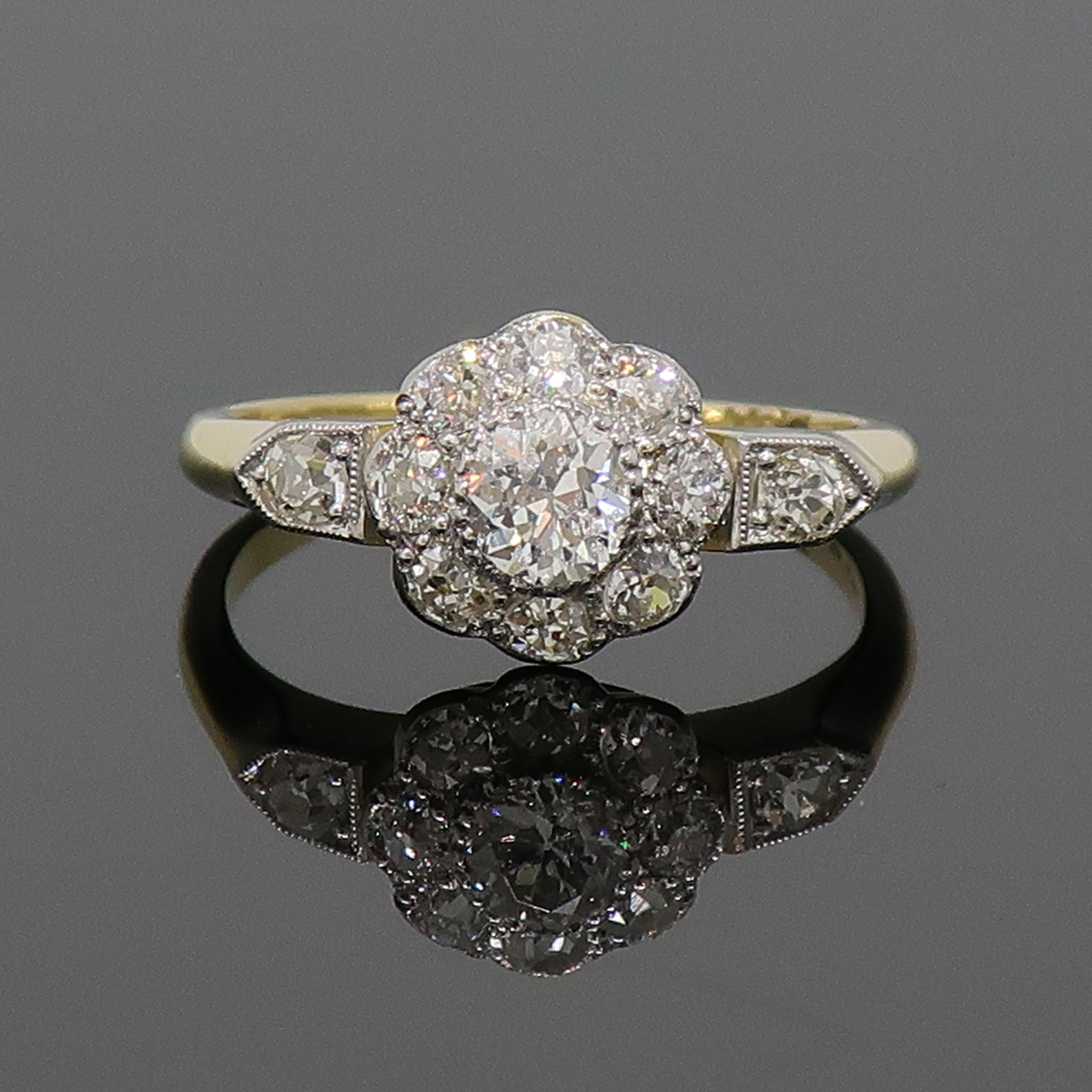 Old Cut Diamond Daisy Cluster Ring 18 Karat Yellow & White Gold

Edwardian classic daisy diamond cluster. Nine stone old cut diamond daisy cluster ring. Central white diamond is larger than the eight outer diamonds, with a further diamond on top of