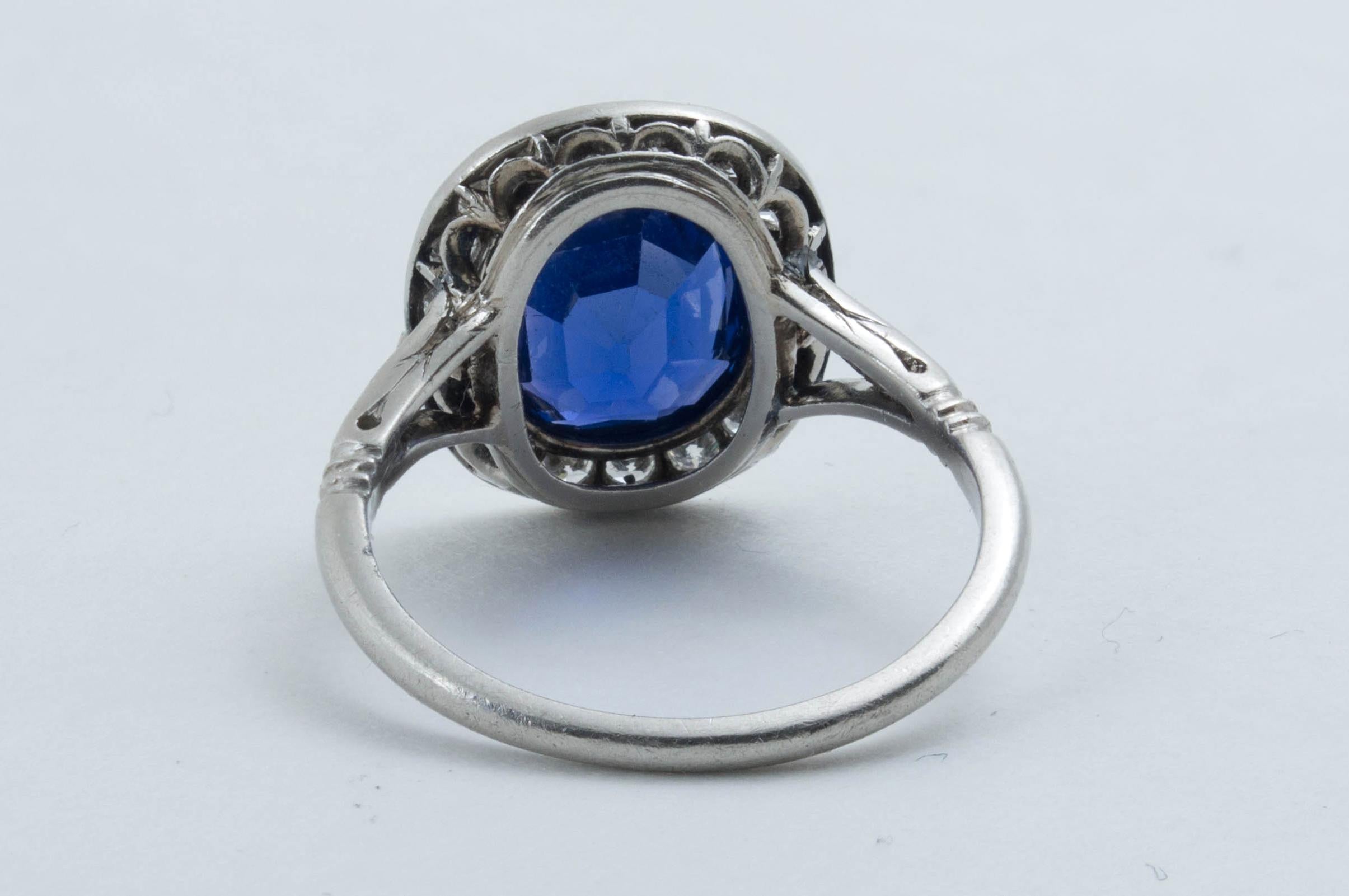 A lovely antique Edwardian sapphire and diamond engagement ring featuring a stunning natural unheated Burmese cushion cut sapphire, all set in platinum, circa 1910. 

The striking ring features a cushion shaped 3.40ct natural unheated Burmese