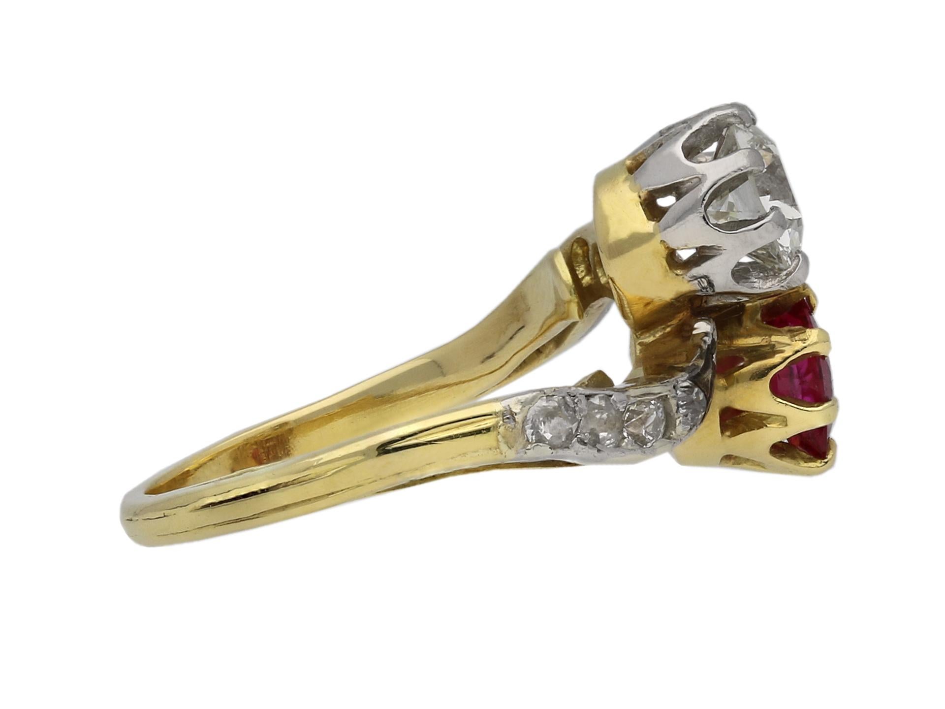 Edwardian Burmese ruby and diamond cross over ring. Set with a cushion shape old cut natural unenhanced Burmese ruby in an open back claw setting with an approximate weight of 0.70 carats, further set with a round old cut diamond with an approximate