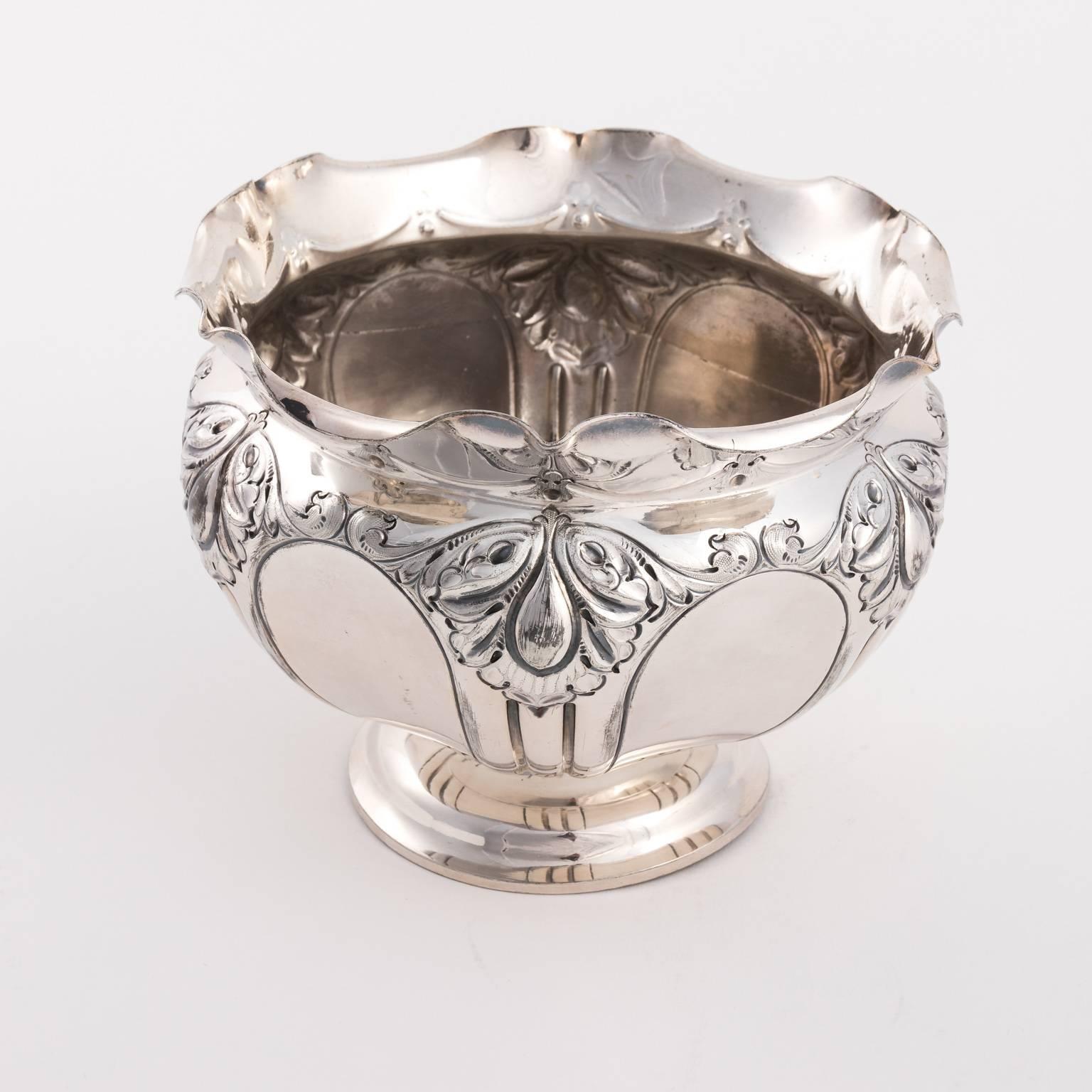 Edwardian silver plated cache pot with ruffled edges and embossed foliage, circa 1900.
 