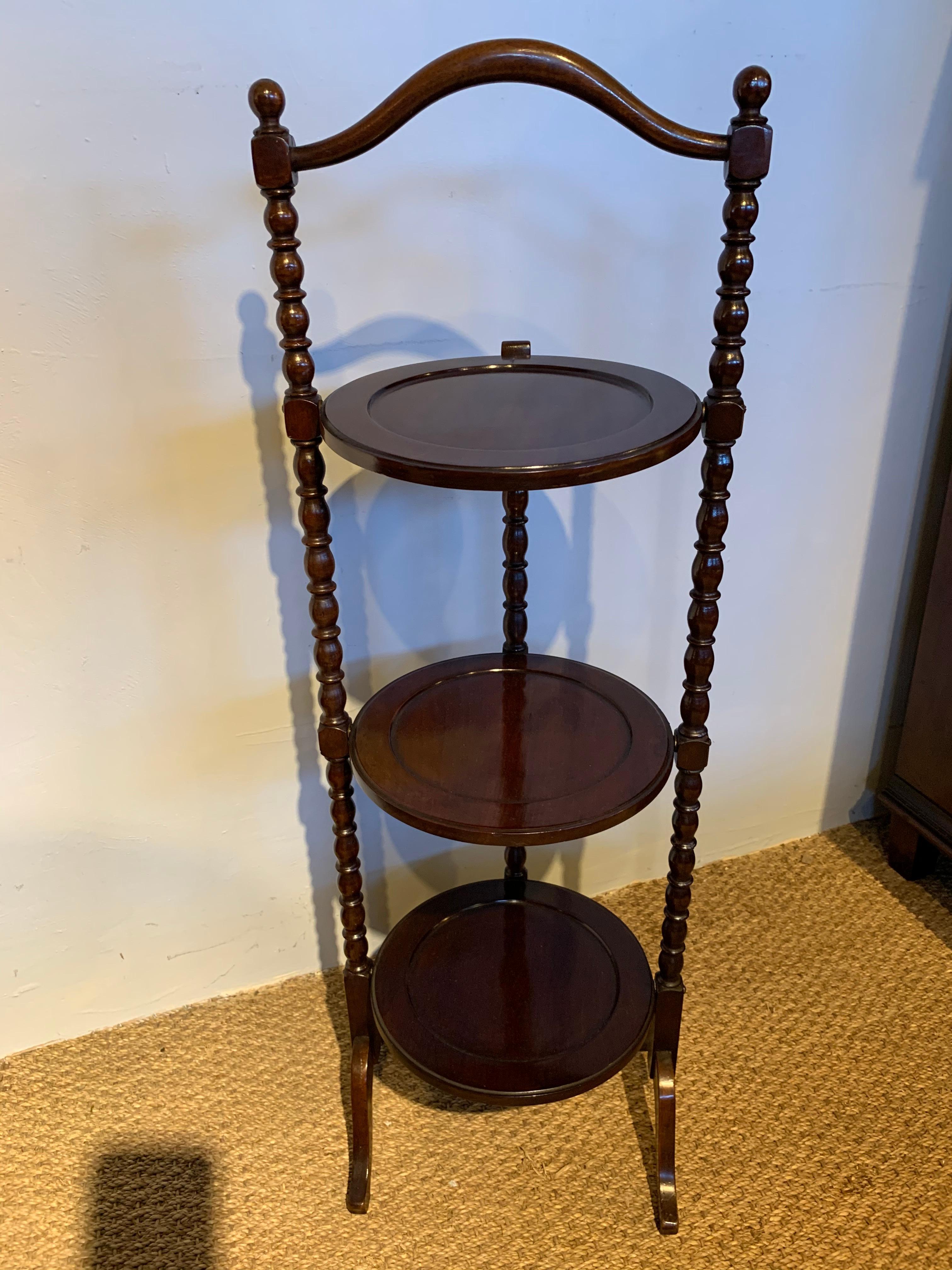 Lovely 3-tier folding Edwardian mahogany cake stand

English dating to circa 1910, having been through our workshops cleaned and wax finished

Measures: Height 36 inches
Width 12 inches
Depth 11 inches.