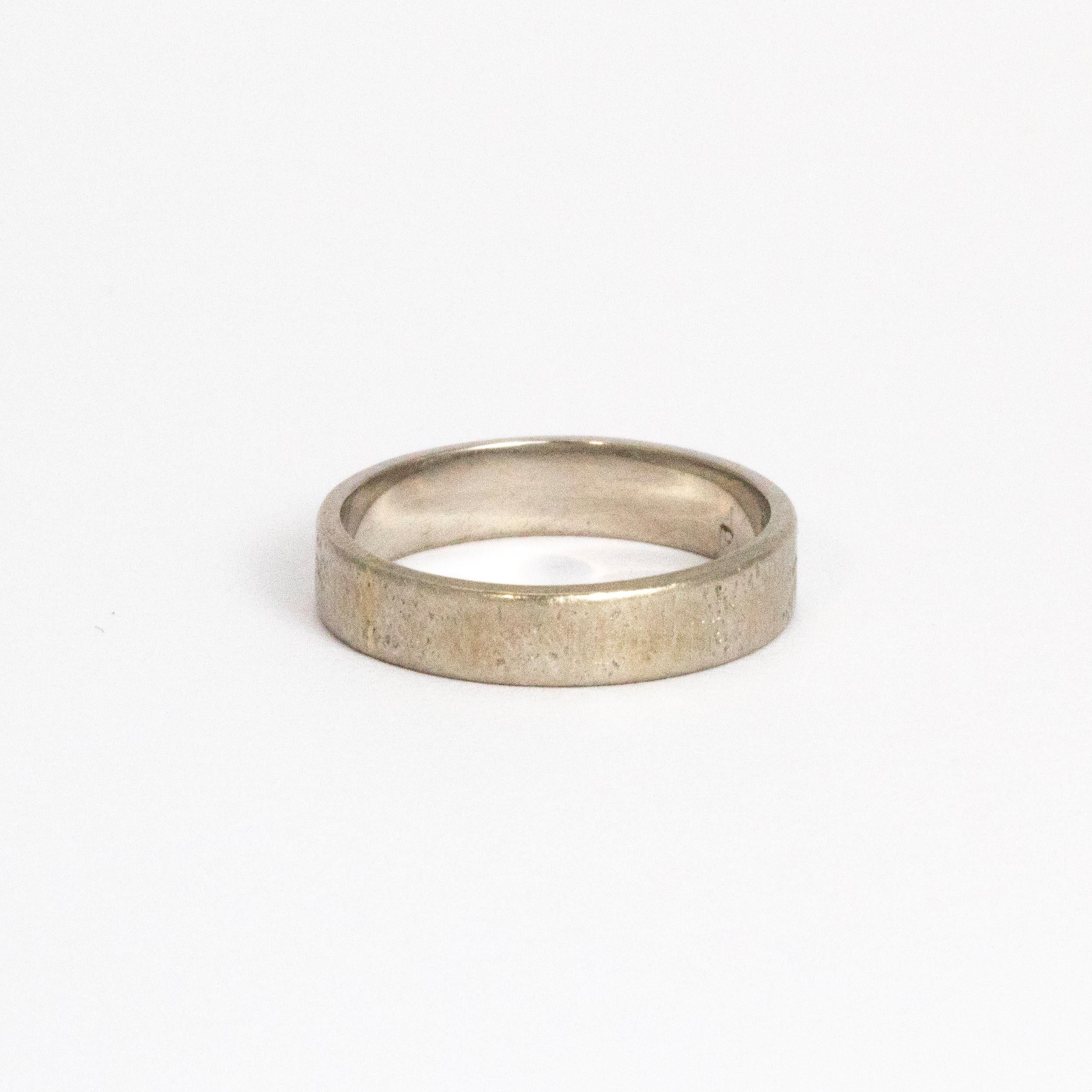 Beautifully simple textured platinum band made by Cartier in the late Edwardian era. 

Ring Size: H 1/2 or 4