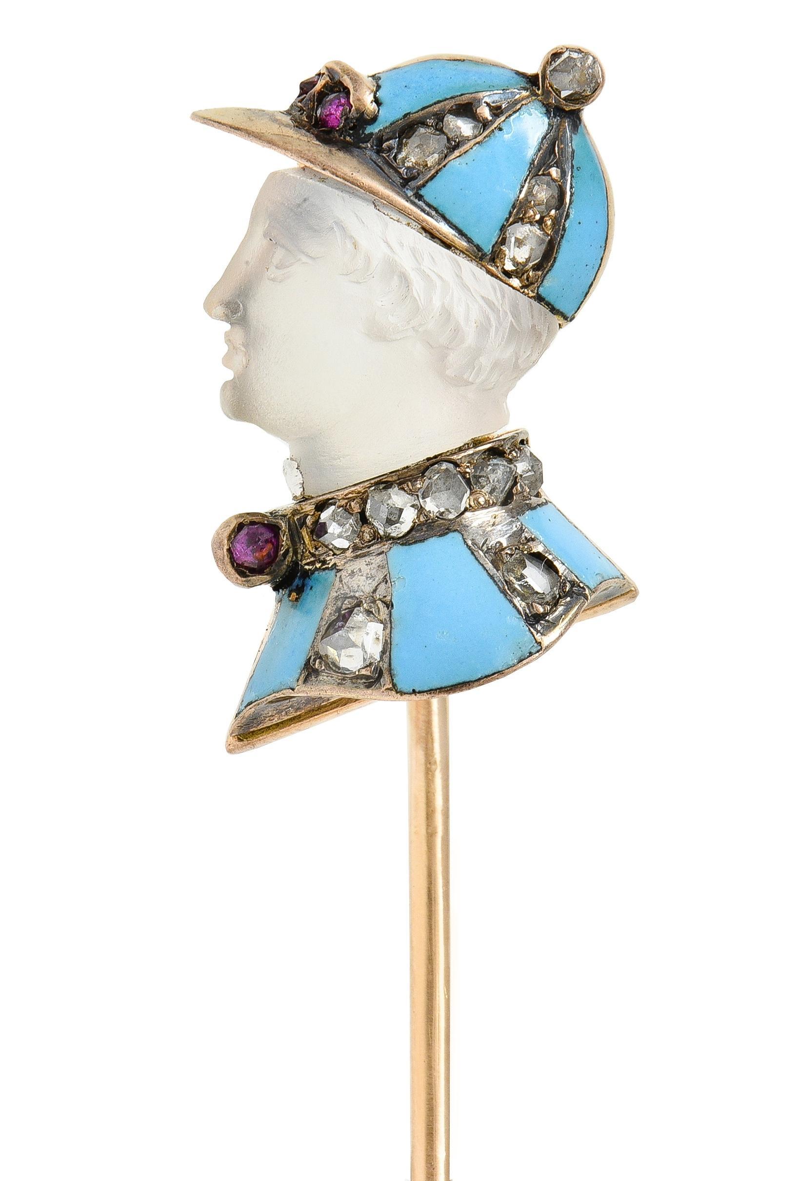 Designed as the profile of an equestrian jockey featuring a carved moonstone face
Measuring approximately 8.0 x 8.5 mm - colorless body with white adularescence
Adorned with matching hat and jacket striped with enamel
Opaque light blue in color -